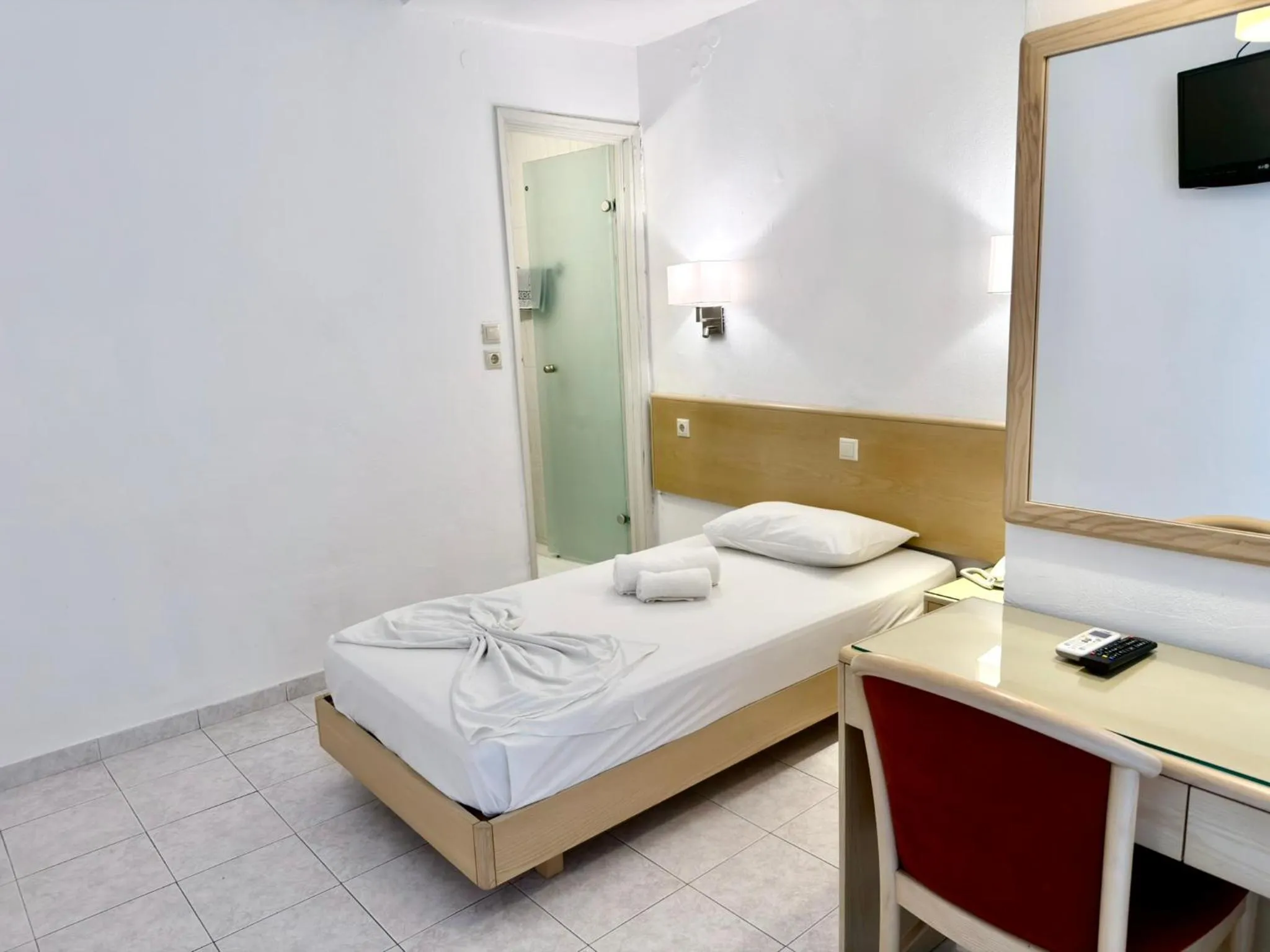 Bed in Savoy City Hotel