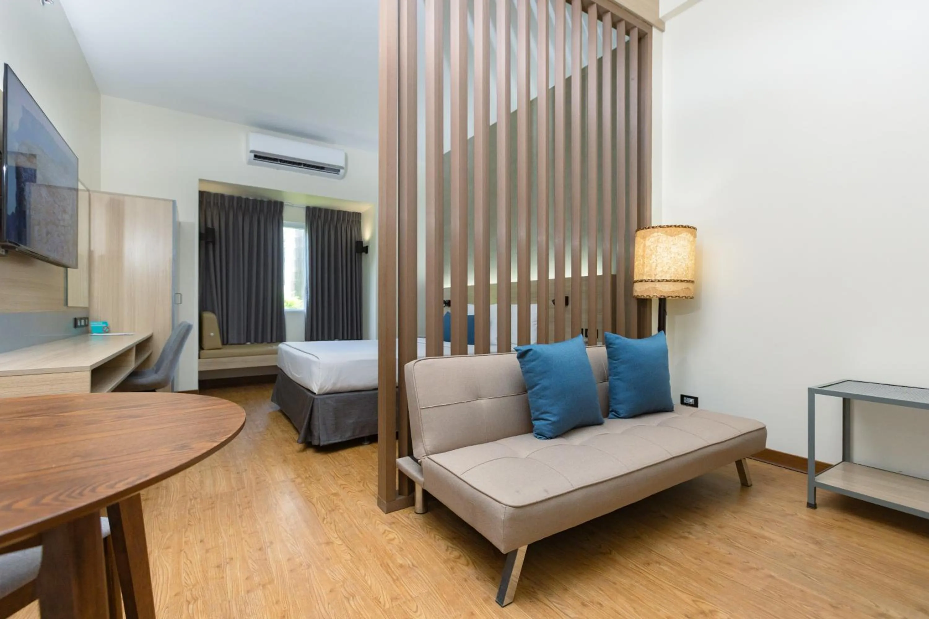 Living room, Bed in Microtel by Wyndham General Santos