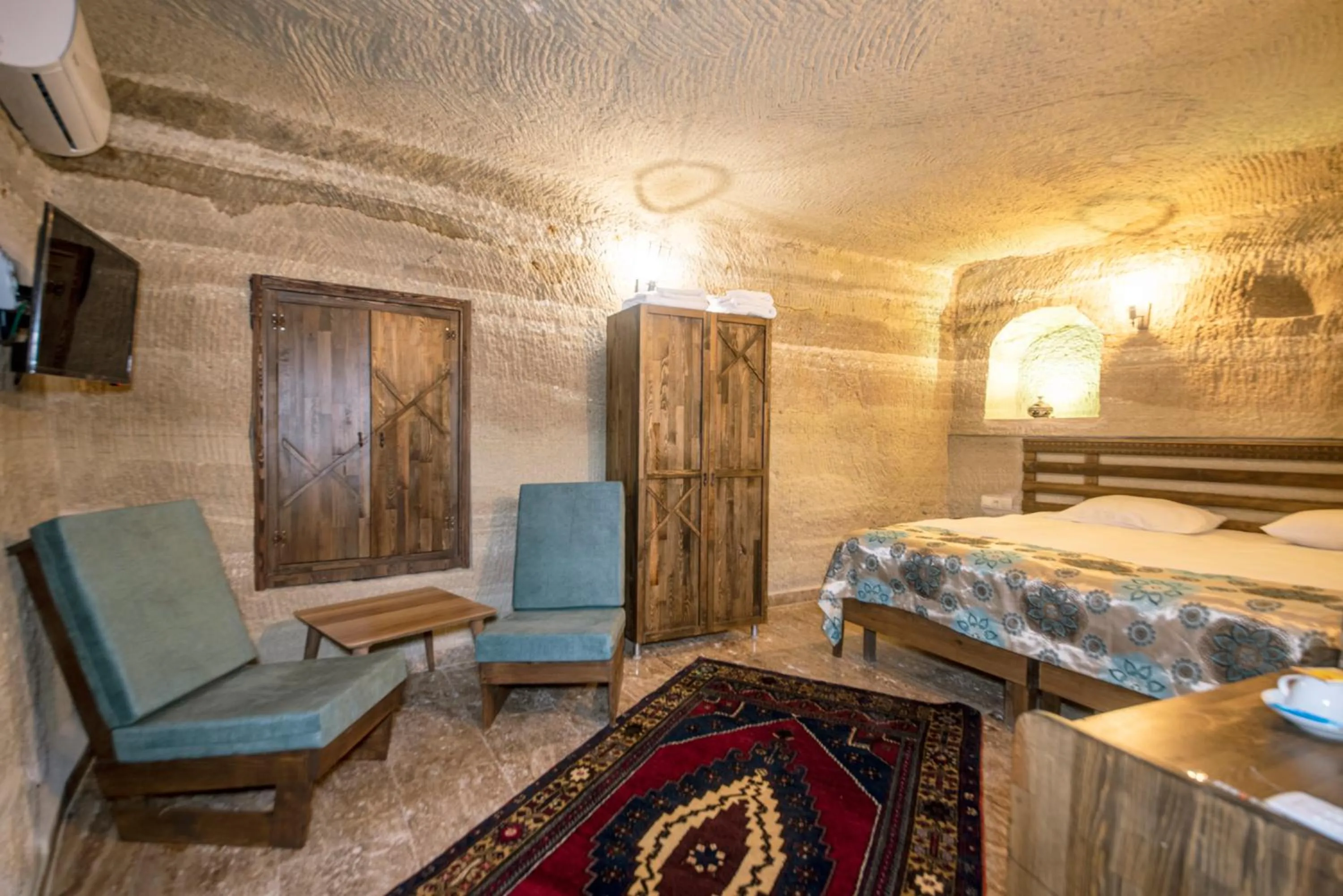 Living room, Bed in Cappadocia Caves Hotel