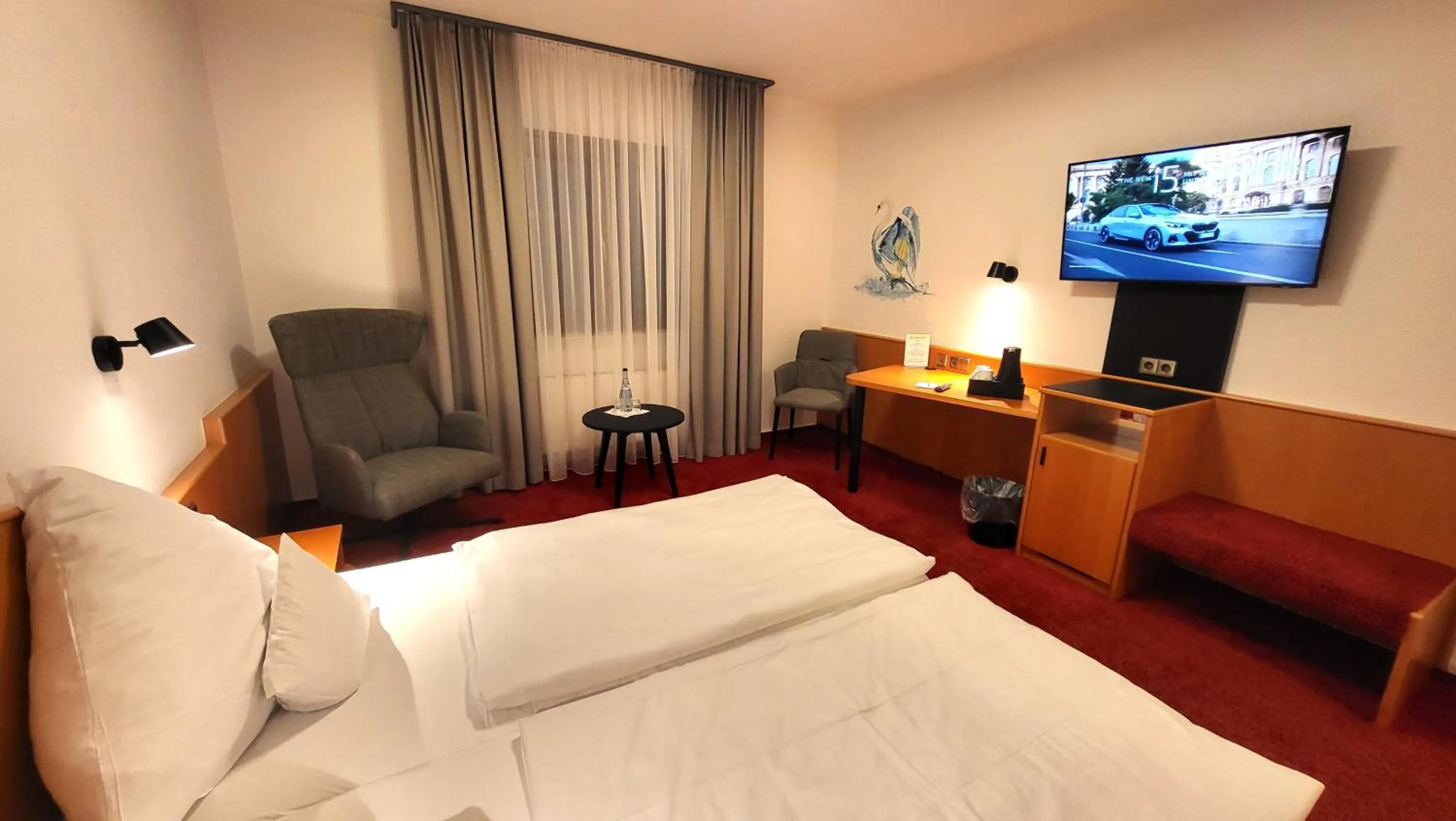 Communal lounge/ TV room, Bed in Hotel Schwanen