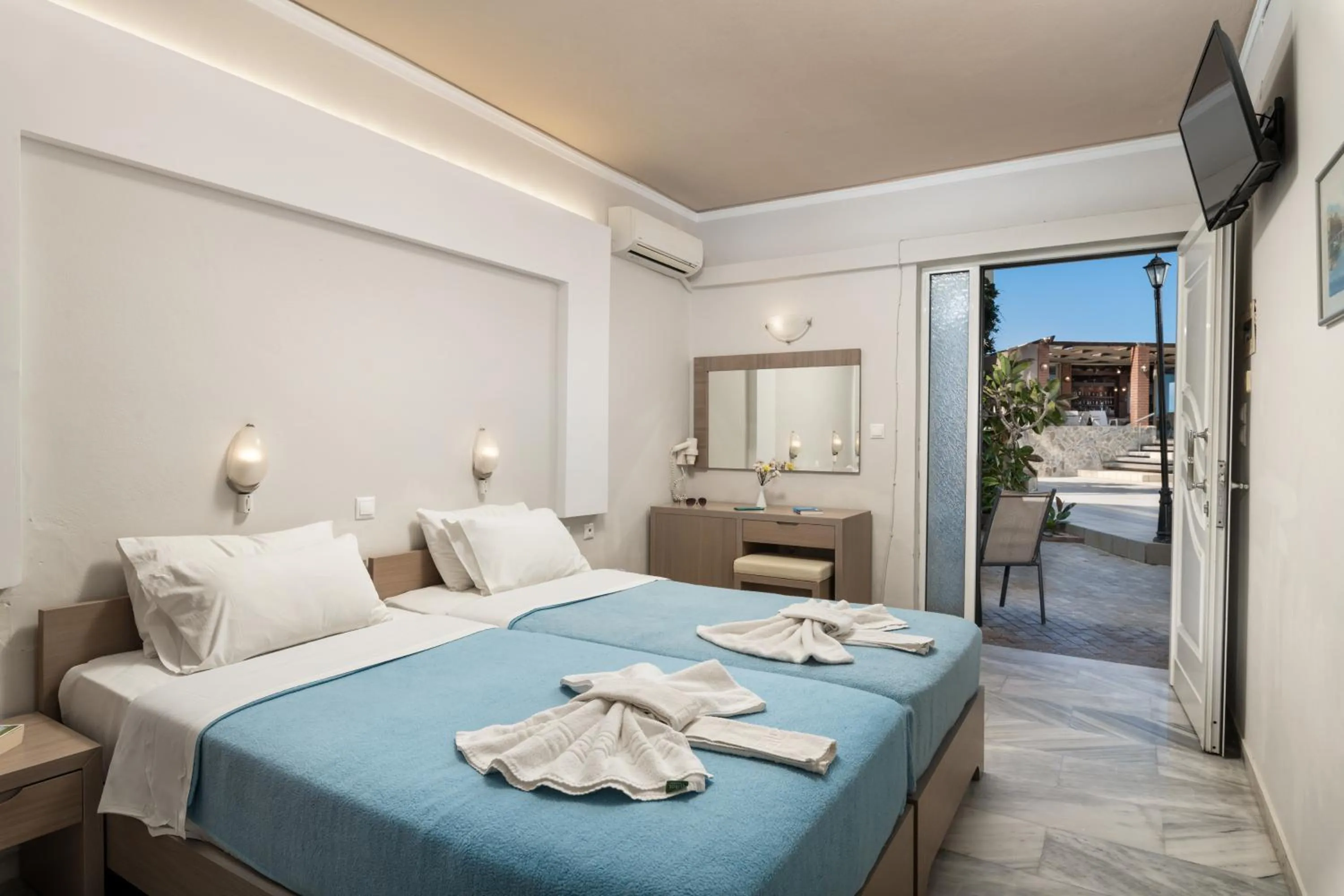 Bed in Hotel Haris on the beach