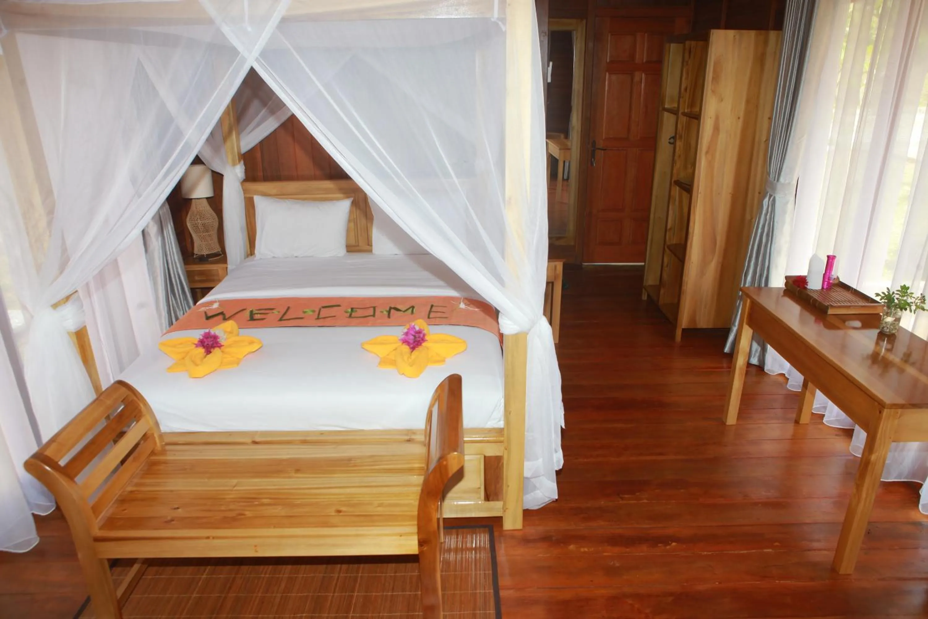 Bed in Bastianos Bangka Dive Resort