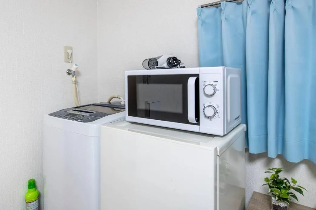 Kitchen or kitchenette in Uhome Tabata Apartment