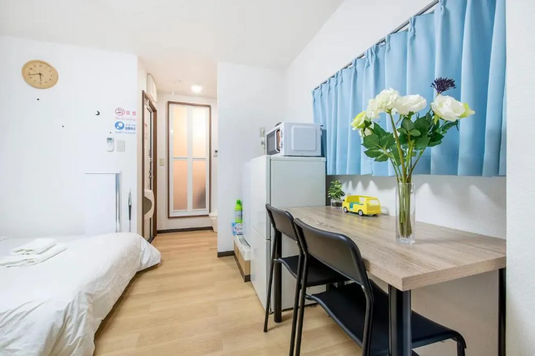 Dining area, Bed in Uhome Tabata Apartment