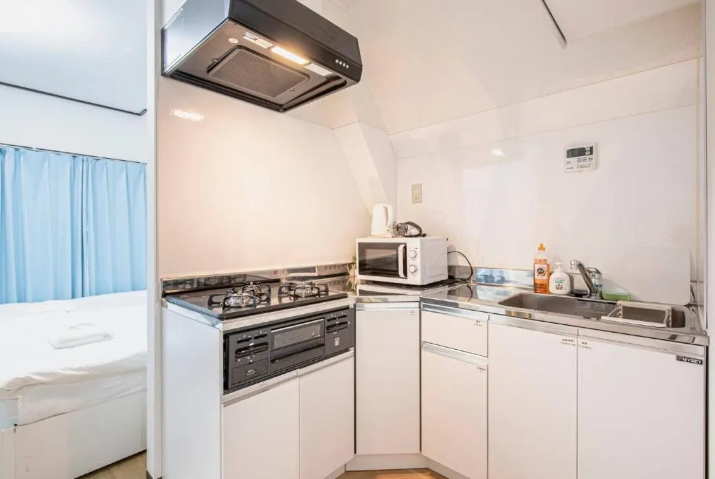 Kitchen or kitchenette in Uhome Tabata Apartment