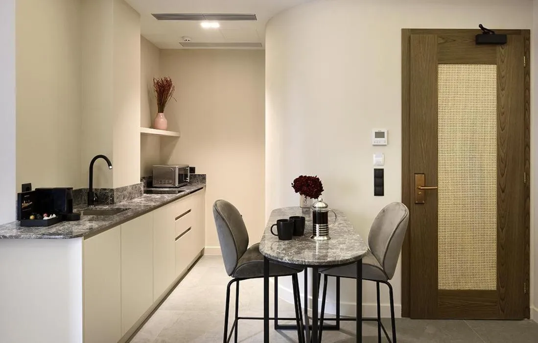 Kitchen or kitchenette in Roomore Apartments