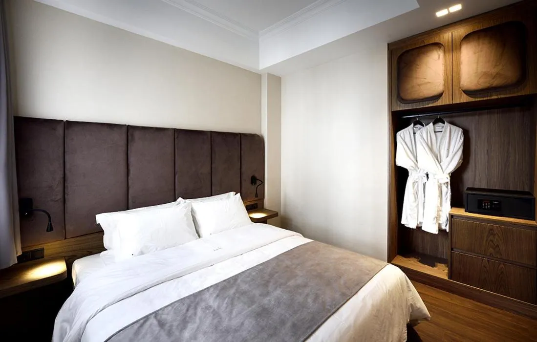 Bed in Roomore Apartments