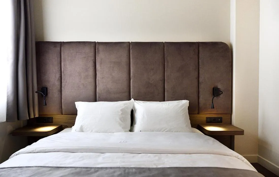 Bed in Roomore Apartments