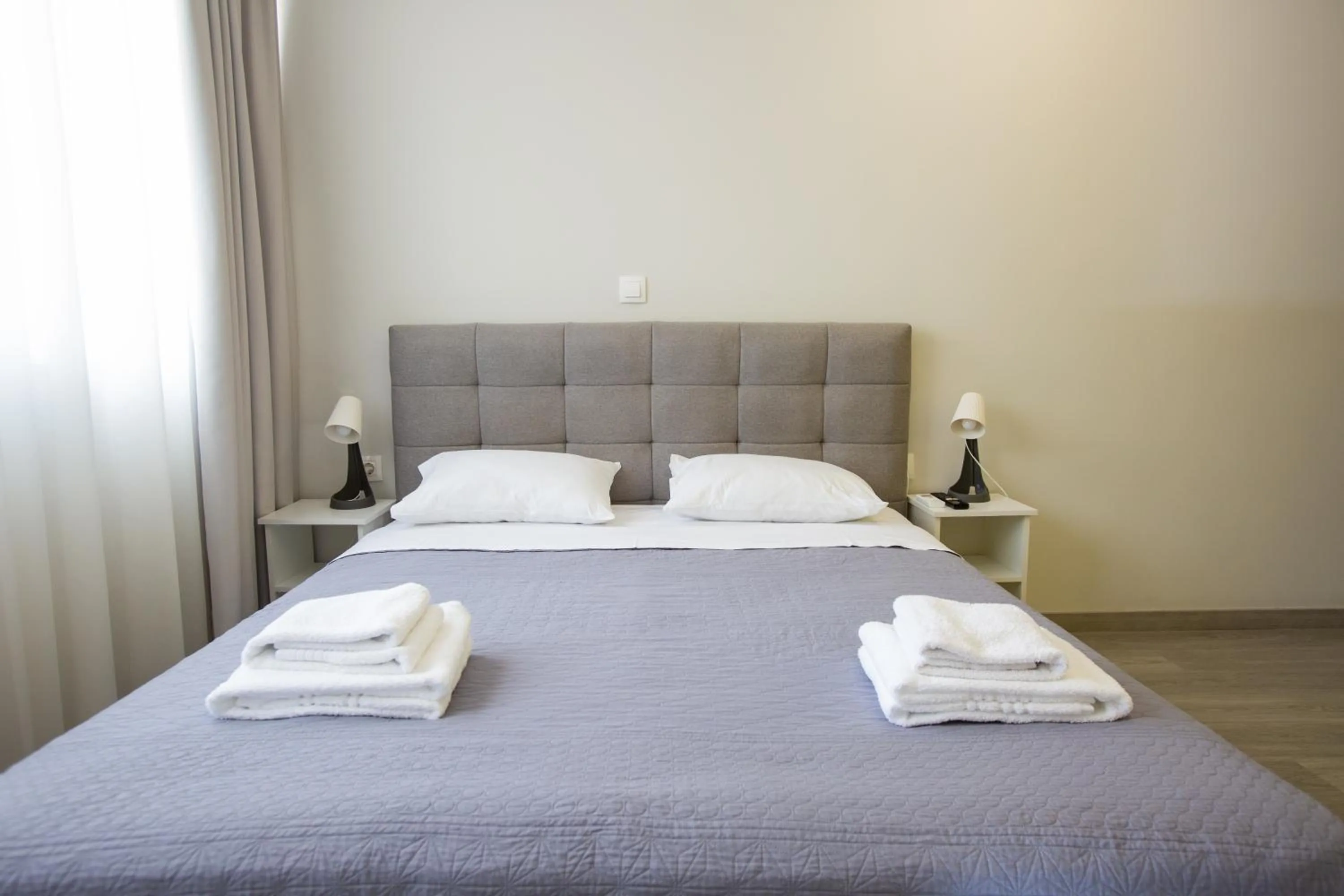 Bed in Raise Boutique Rooms in the Center of Athens
