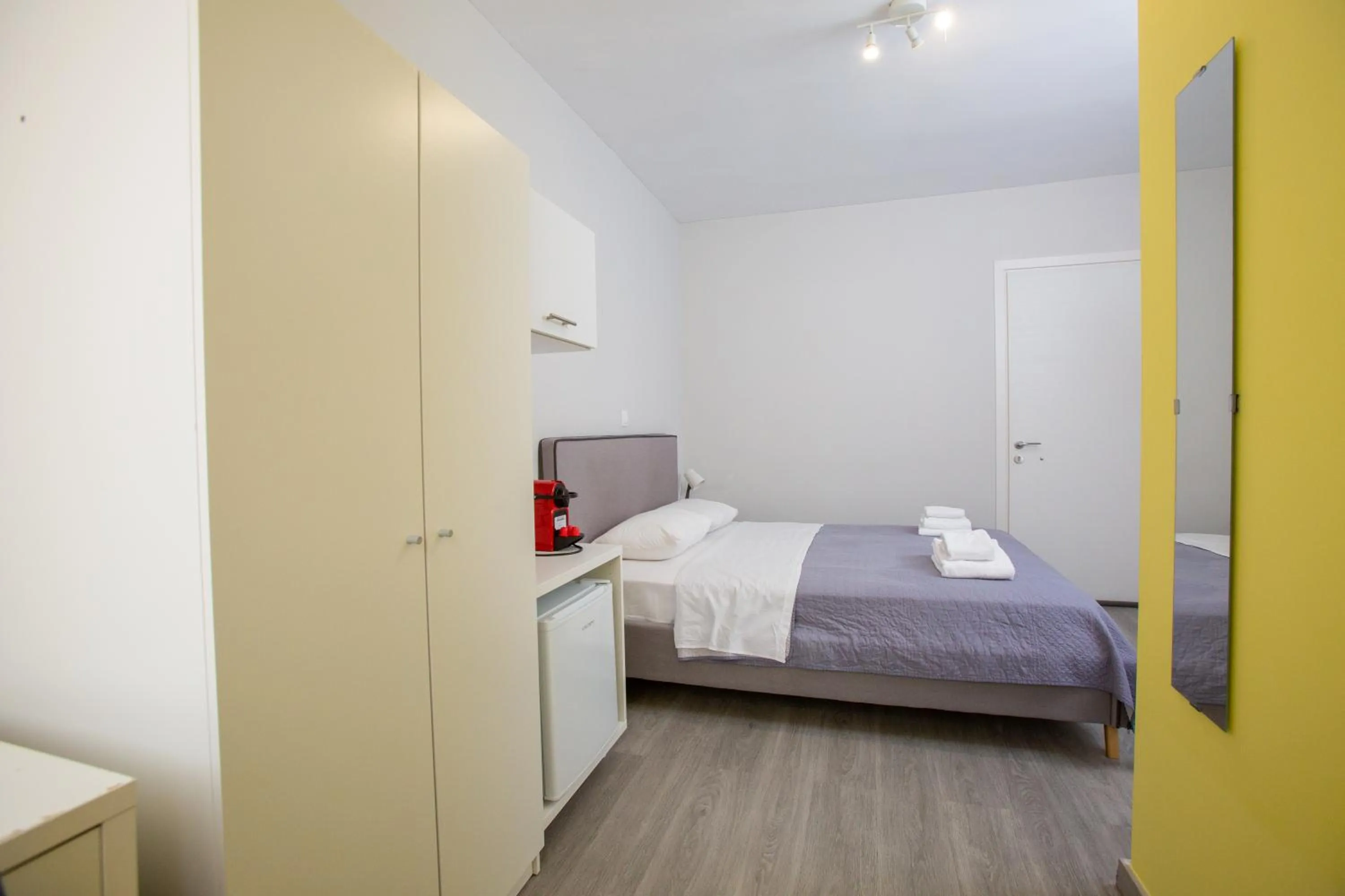 Bed in Raise Boutique Rooms in the Center of Athens