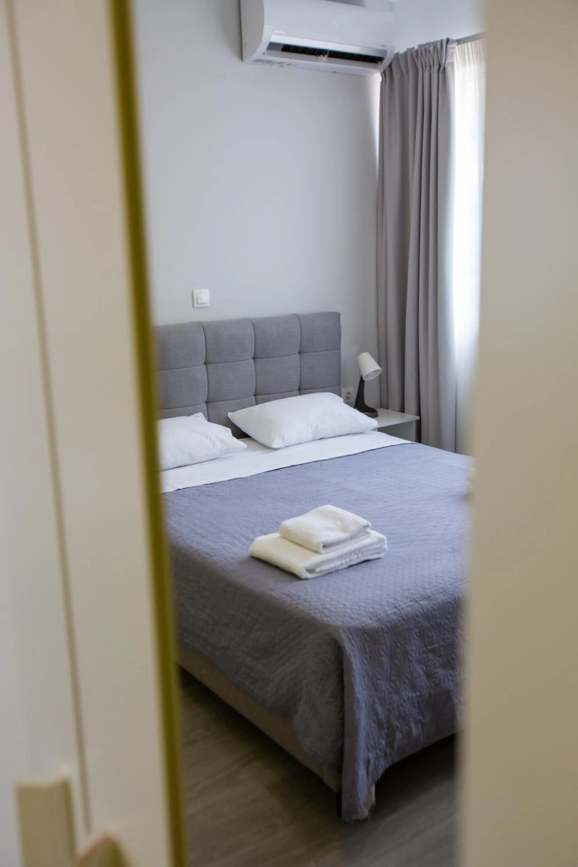 Bed in Raise Boutique Rooms in the Center of Athens