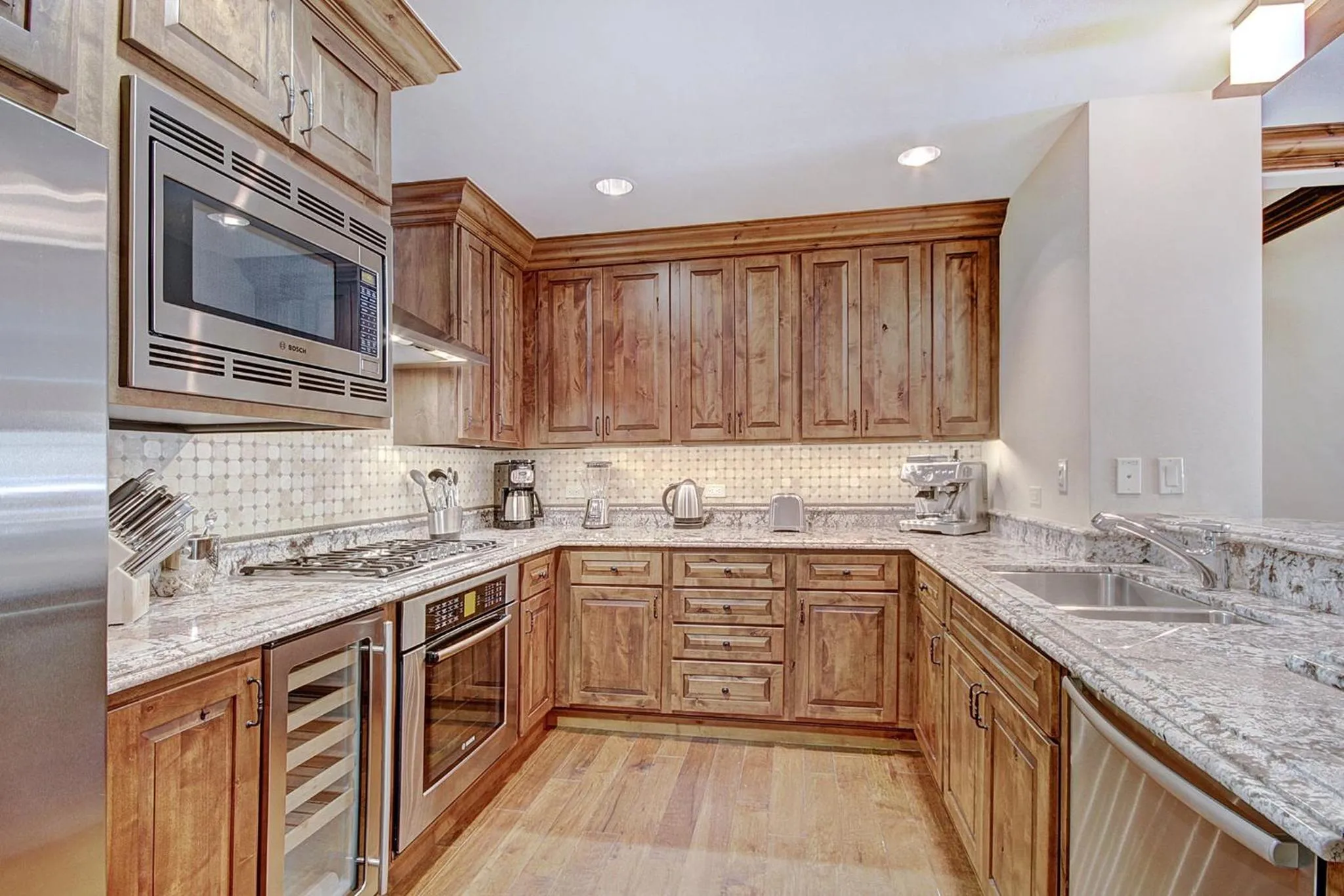 Communal kitchen in Legendary Lodging at the Ritz Carlton Residences Vail, A Vail Resorts Property