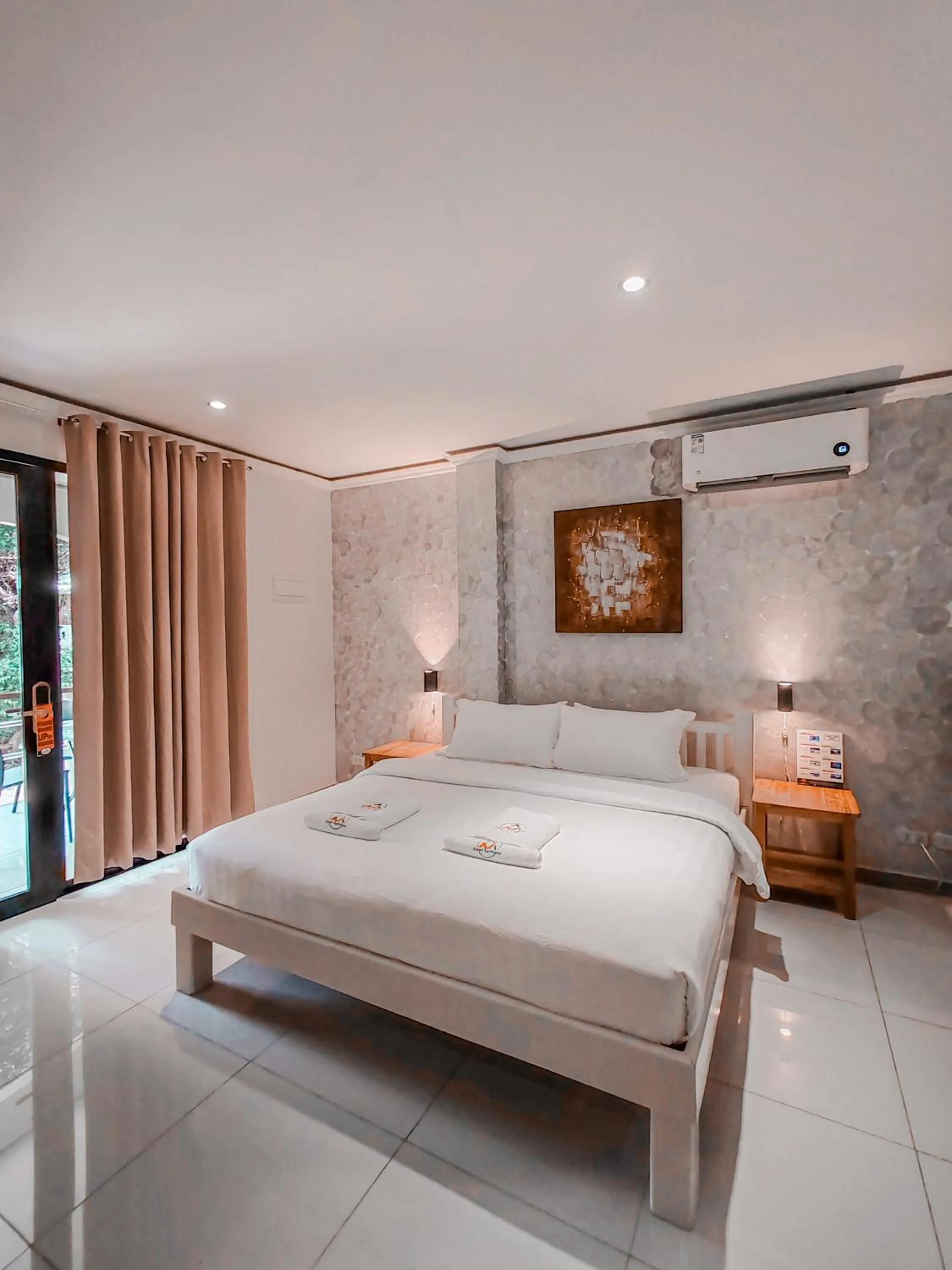 Bed in Alona Northland Resort