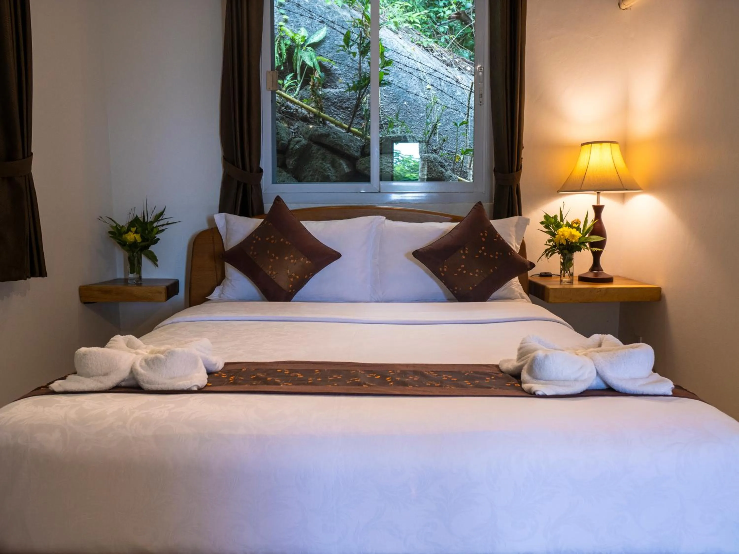 Bed in Monkey Flower Villas