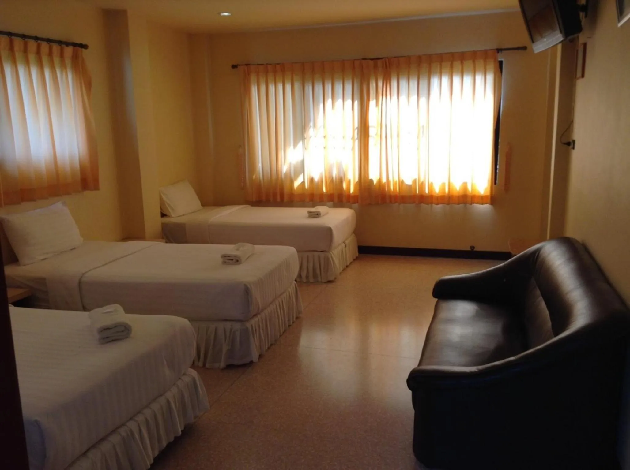 Photo of the whole room, Bed in Srisomthai Hotel
