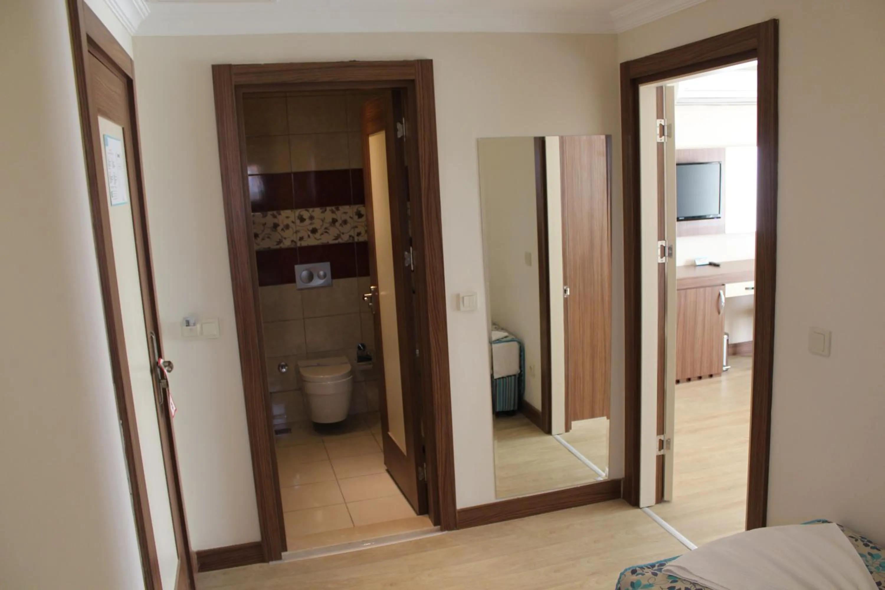 Toilet, Bed in Side West Park Hotel