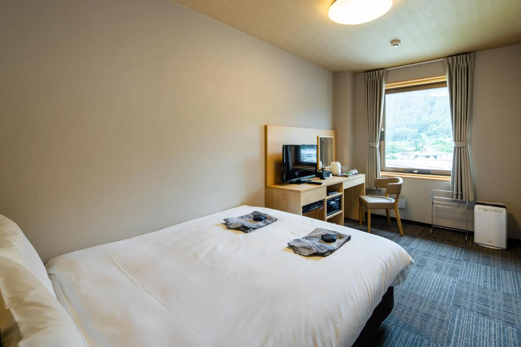 Bed in Fujikawaguchiko Resort Hotel