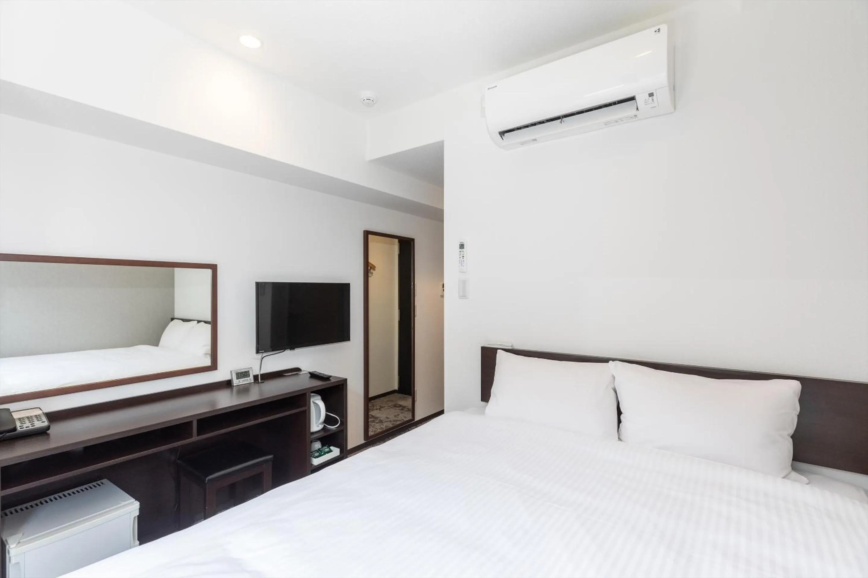 Bed in Hotel Tetora Kyoto Station