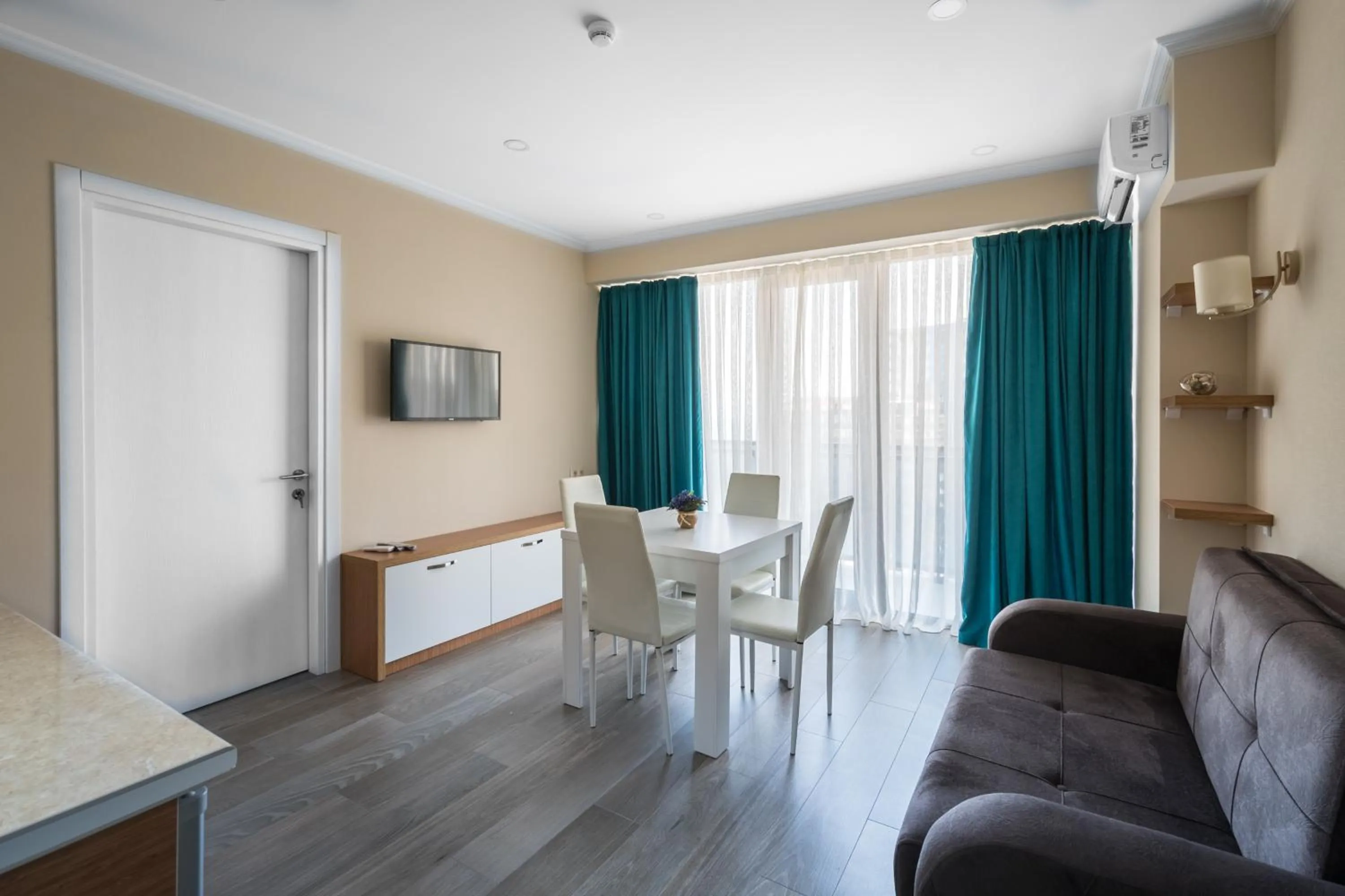 Communal lounge/ TV room in Orbi Beach Tower Hotel Official