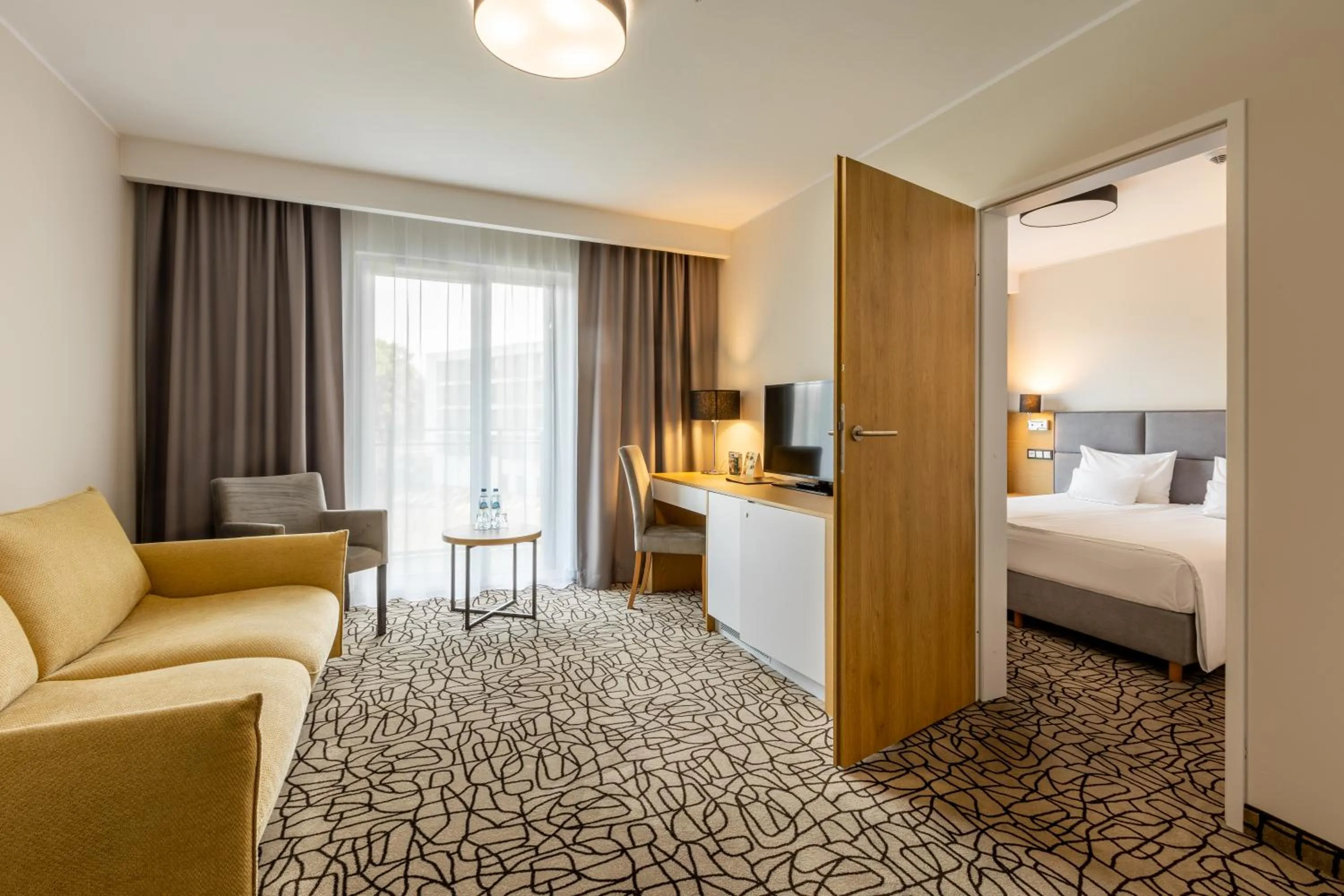 Living room, Bed in Aparthotel Termy Uniejów