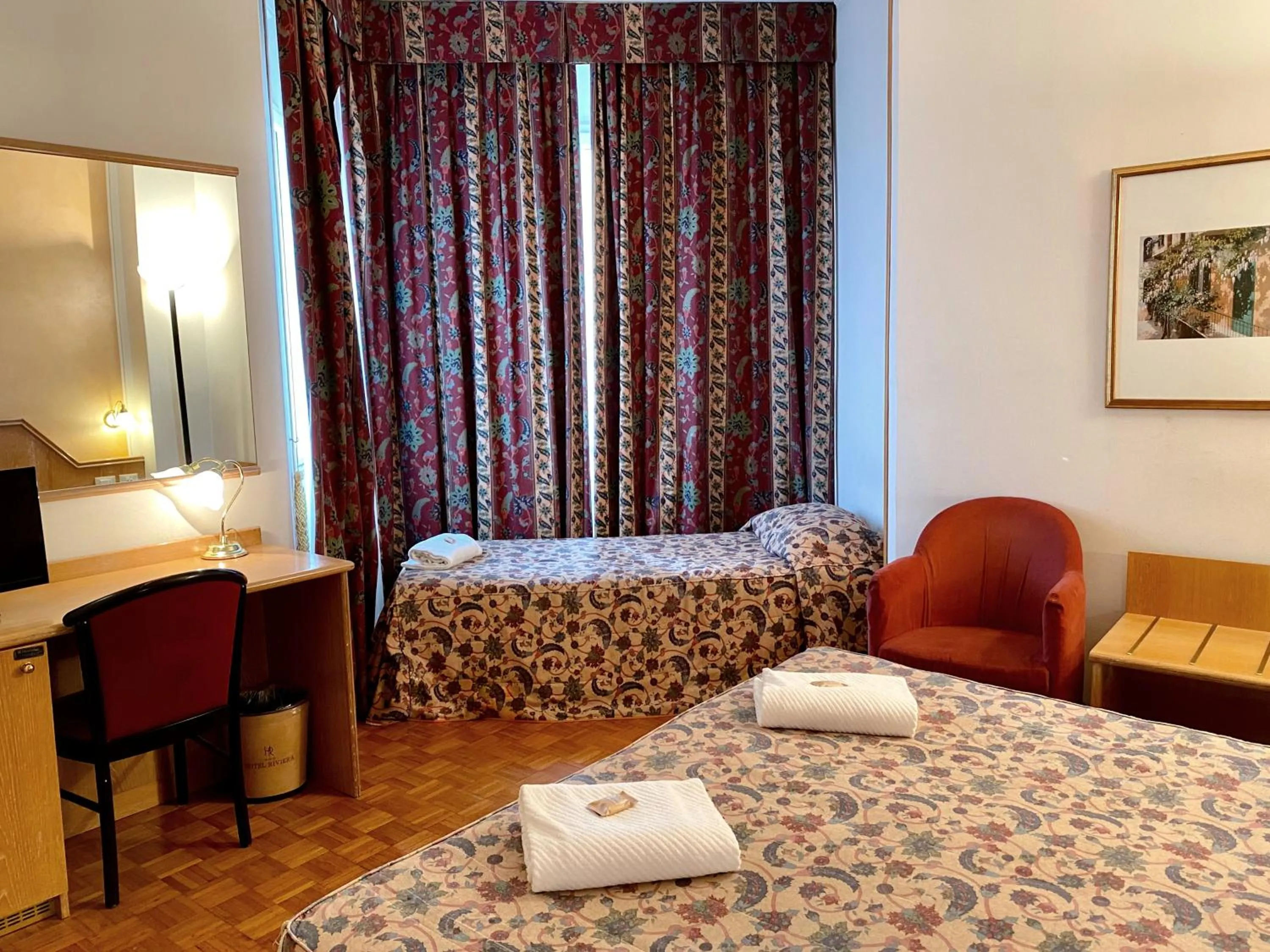 Bed in Hotel Riviera