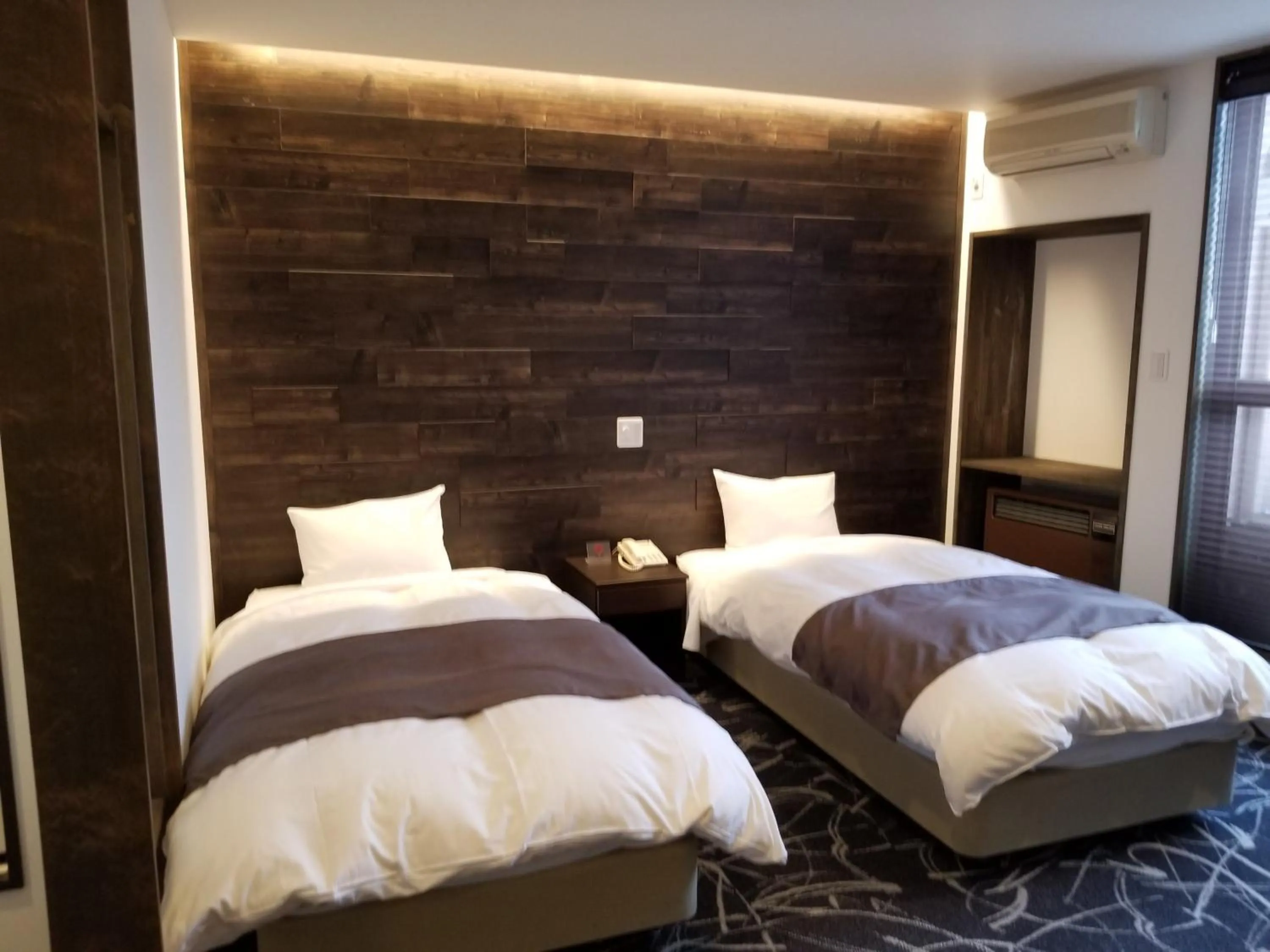 Bed in Hakuba Hotel Hana-no-Sato