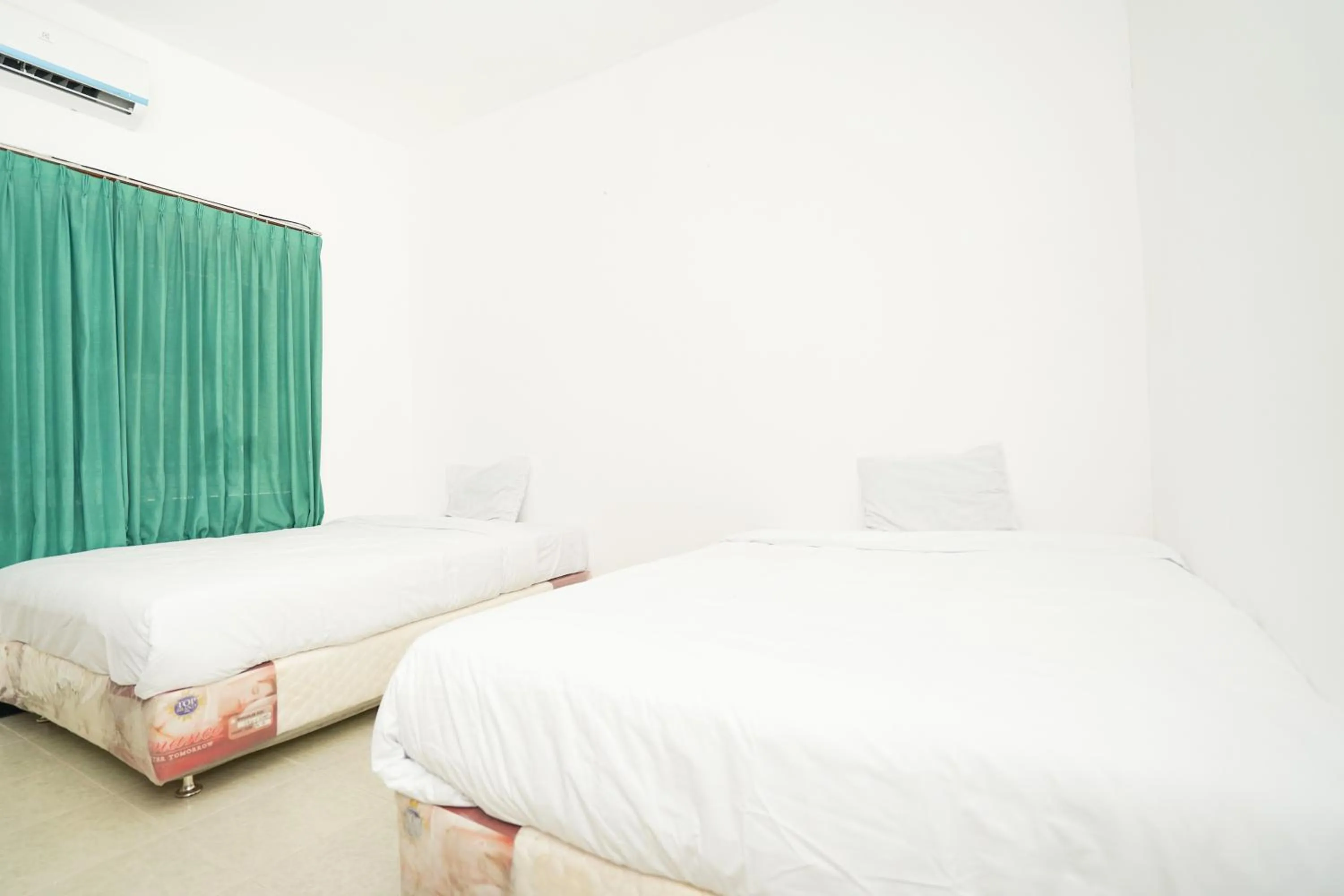 Bedroom, Bed in Merapi Inn Syariah by ecommerceloka