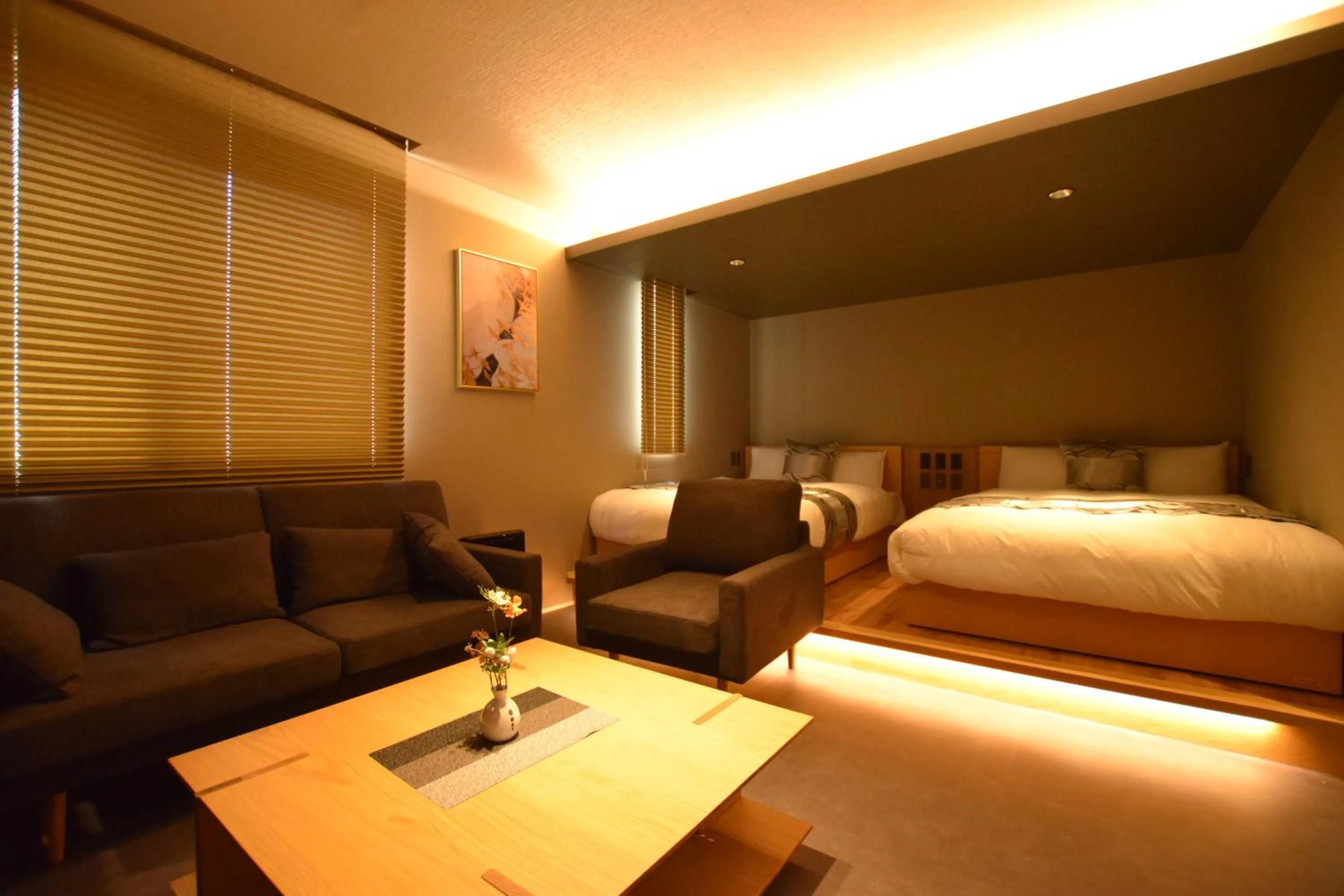 Photo of the whole room, Bed in GRAND BASE Beppu Ekimae