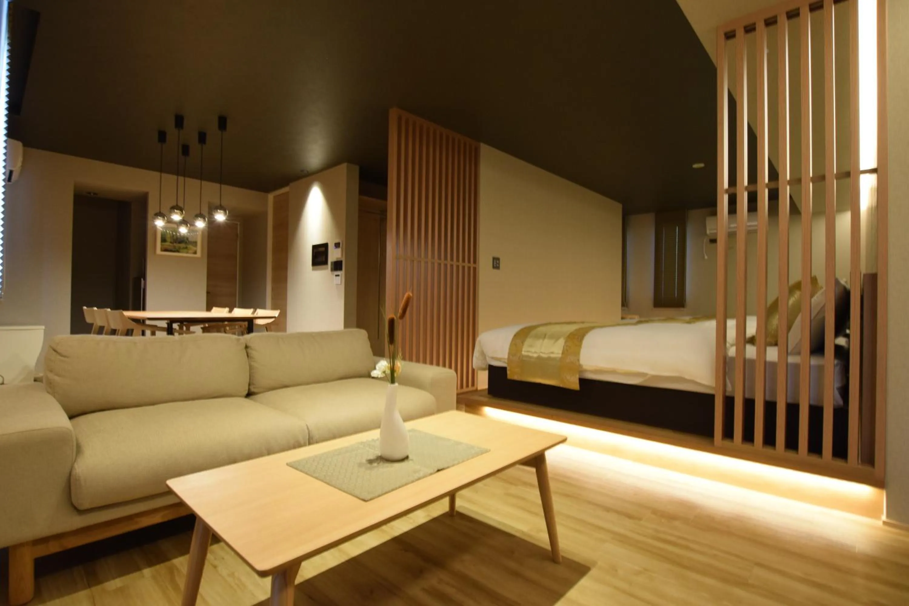 Photo of the whole room, Bed in GRAND BASE Beppu Ekimae