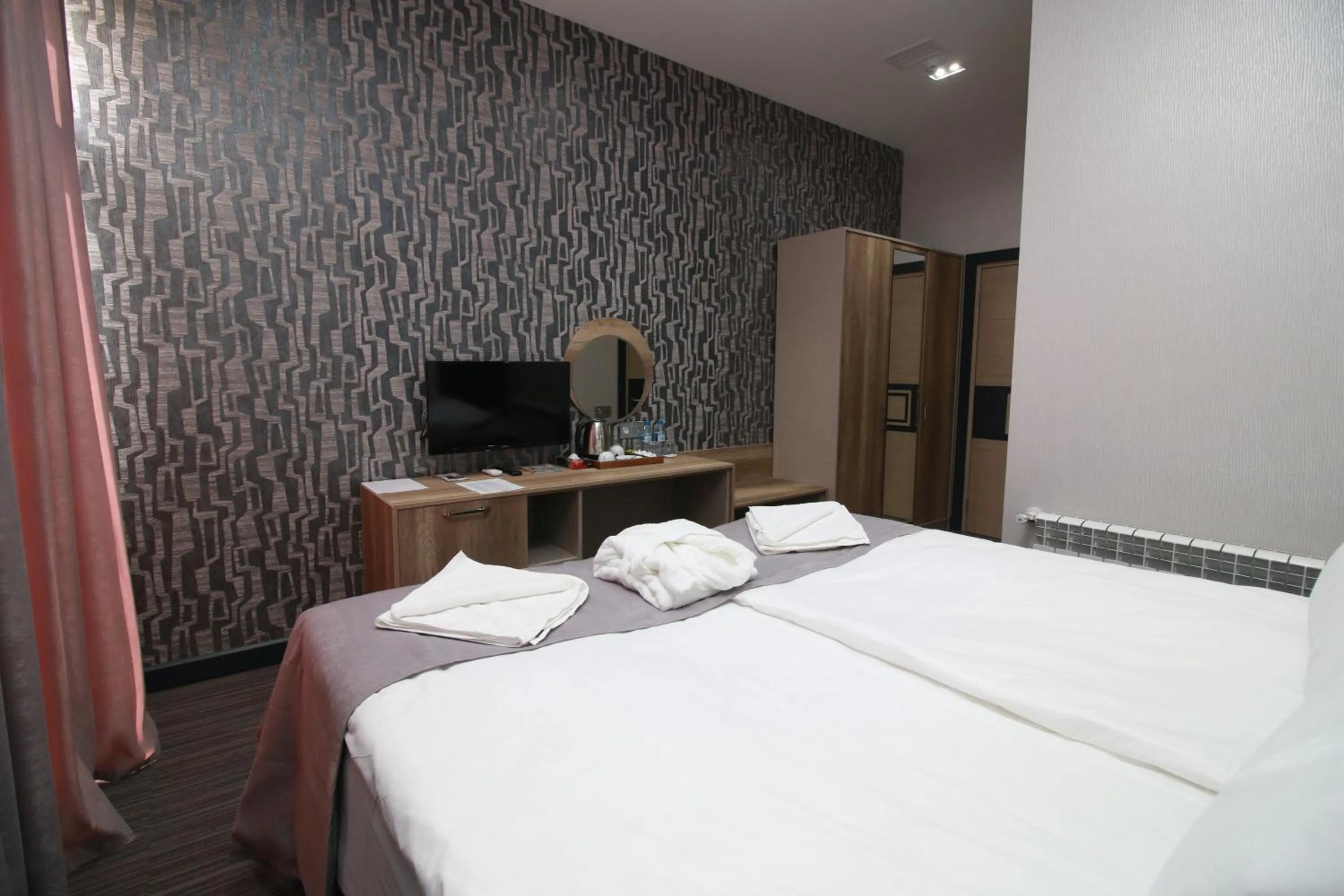 TV and multimedia in Home Suites Baku-Halal Hotel