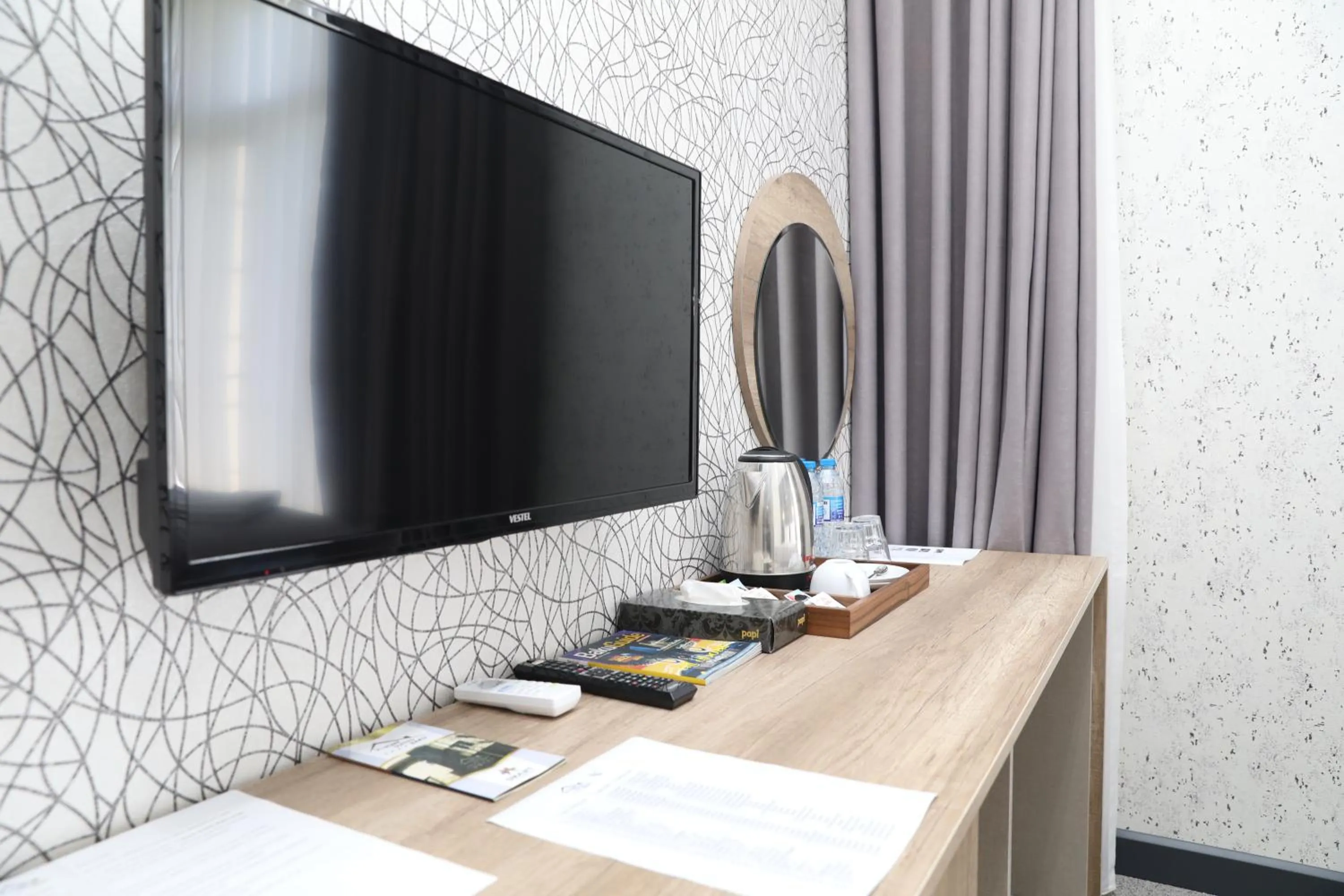 TV and multimedia in Home Suites Baku-Halal Hotel