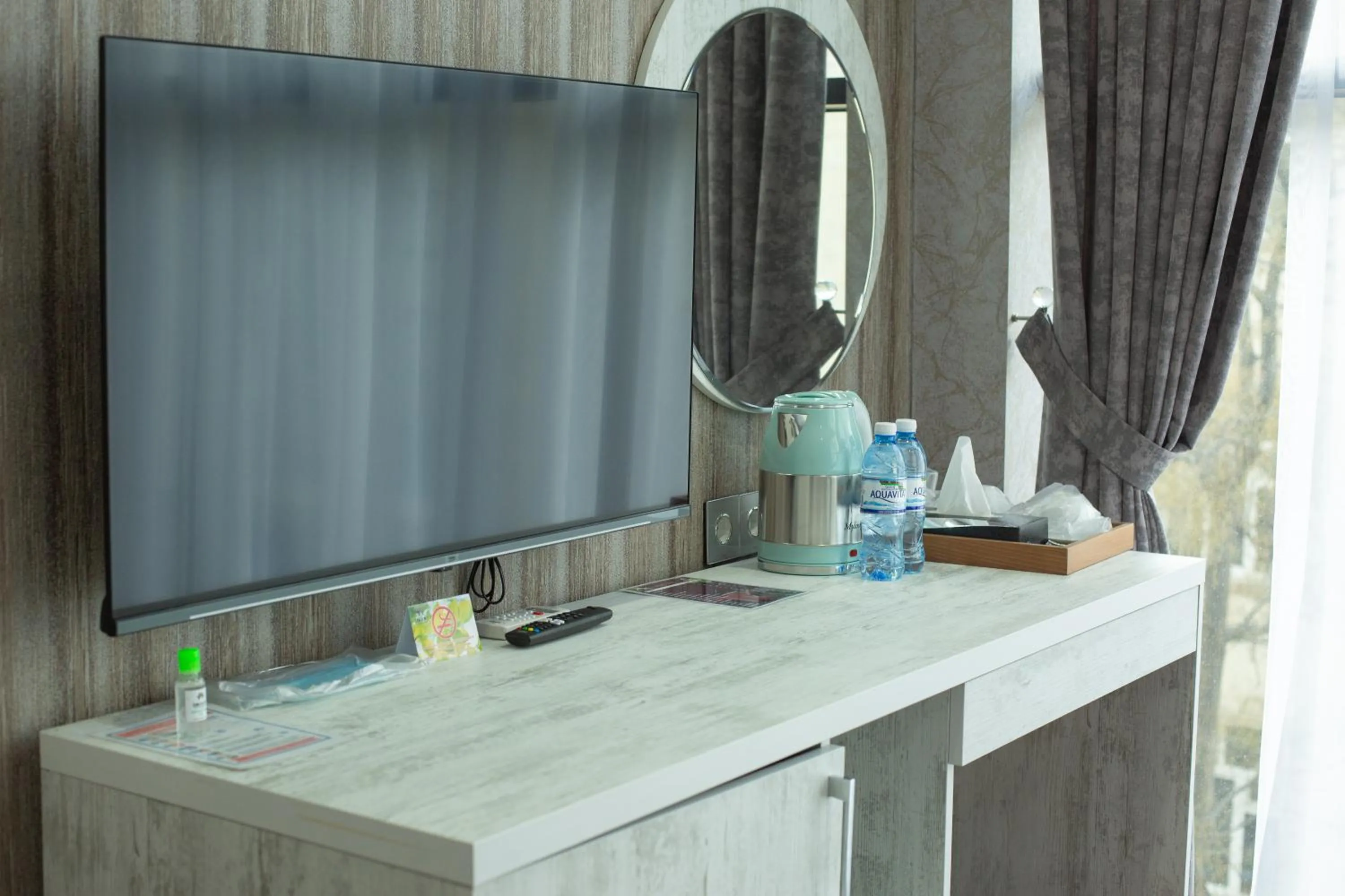 TV and multimedia in Home Suites Baku-Halal Hotel