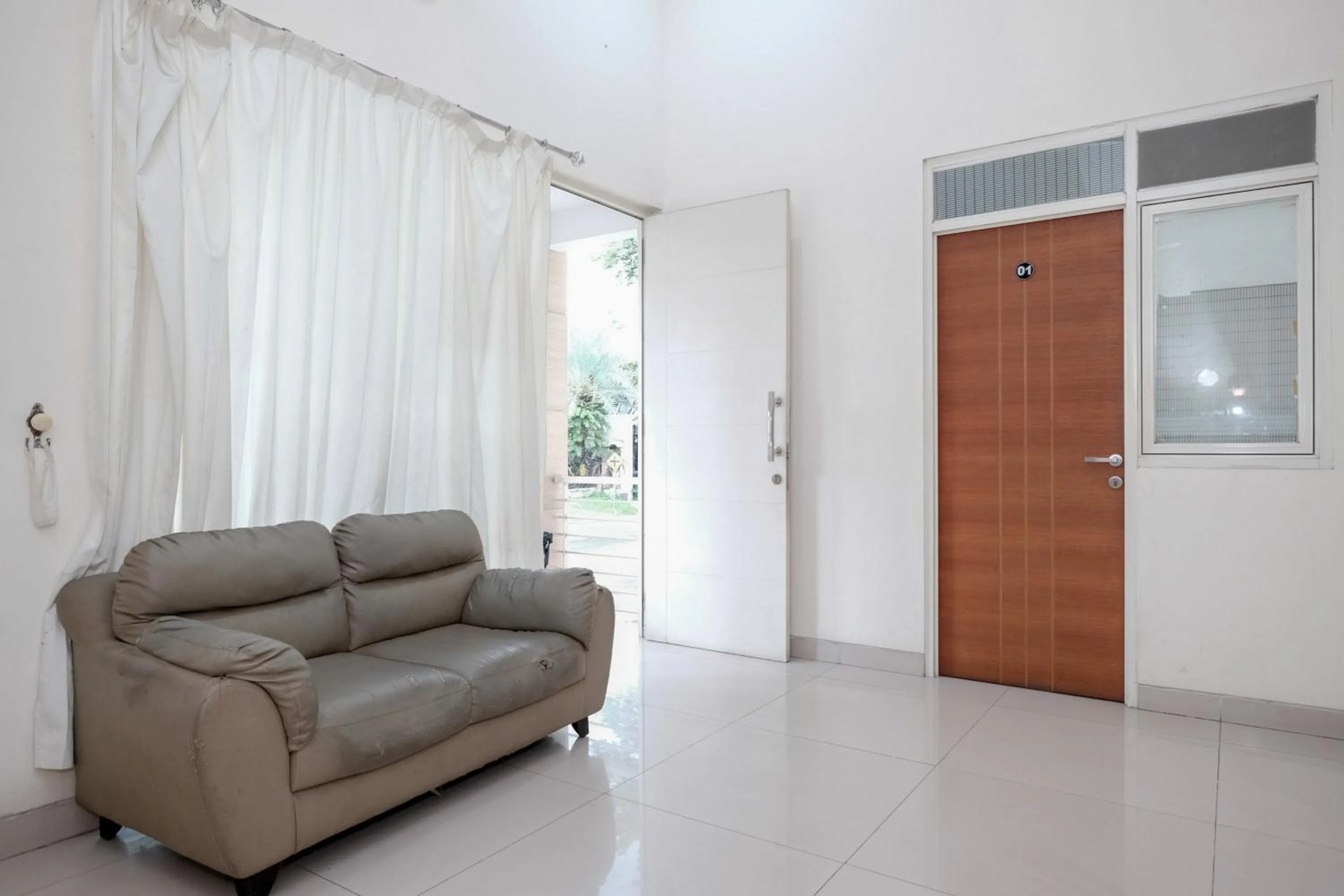 Seating area in RedDoorz near UNESA Citraland Surabaya