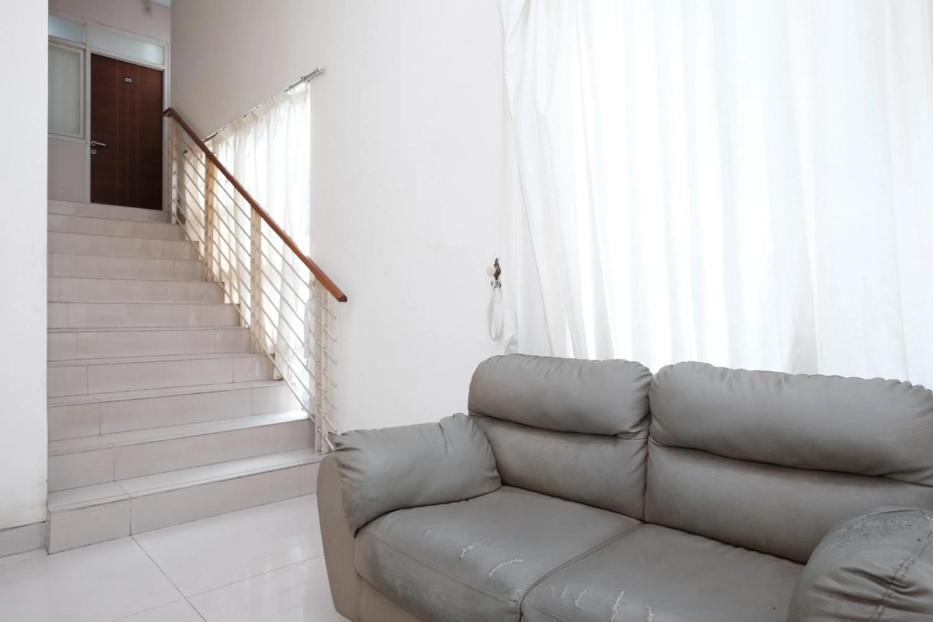 Seating area in RedDoorz near UNESA Citraland Surabaya