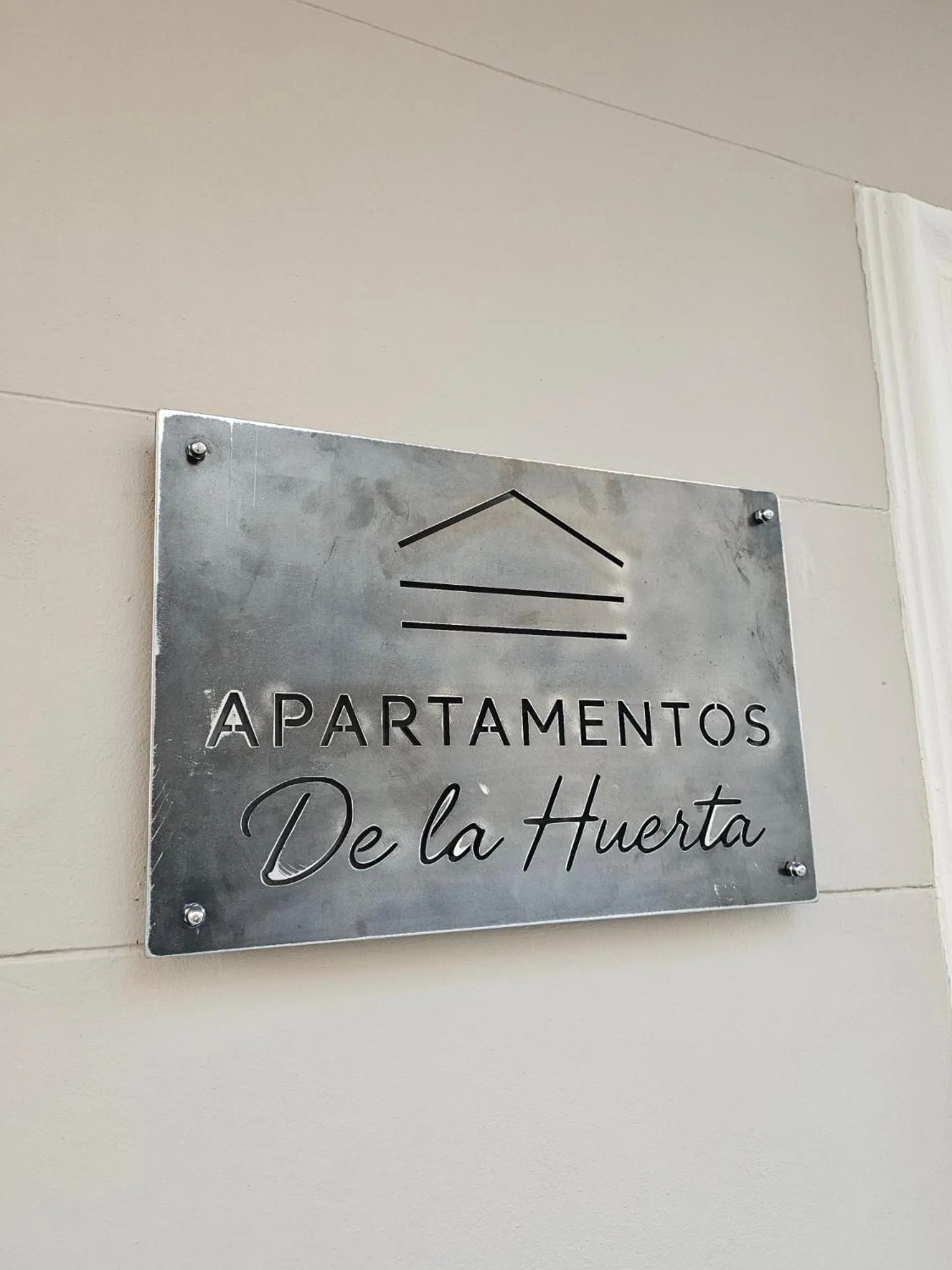 Property logo or sign in Apartamentos de la Huerta