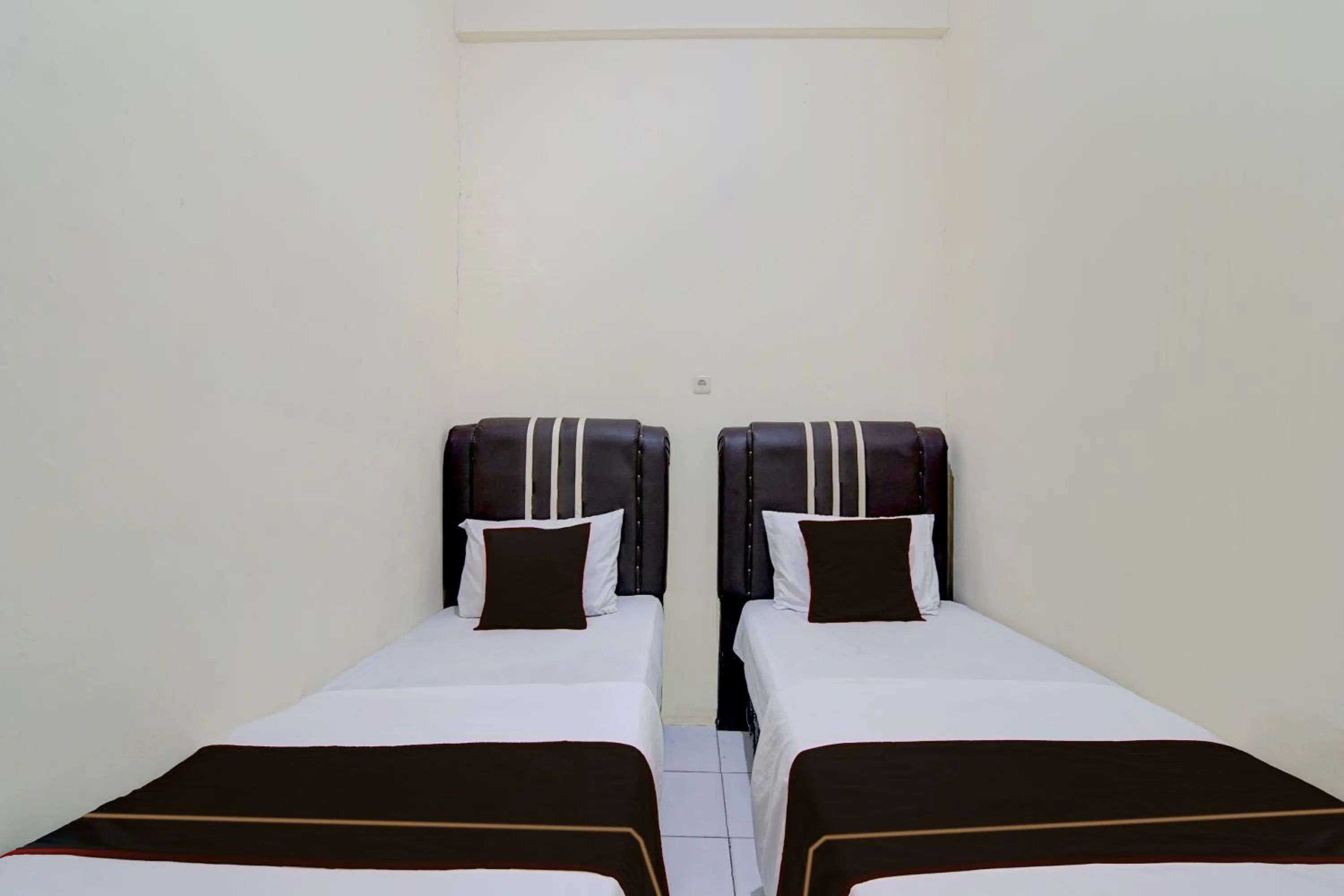 Bedroom, Bed in Hotel O Pekanbaru near Mall Ciputra Seraya formerly Lotus Inn