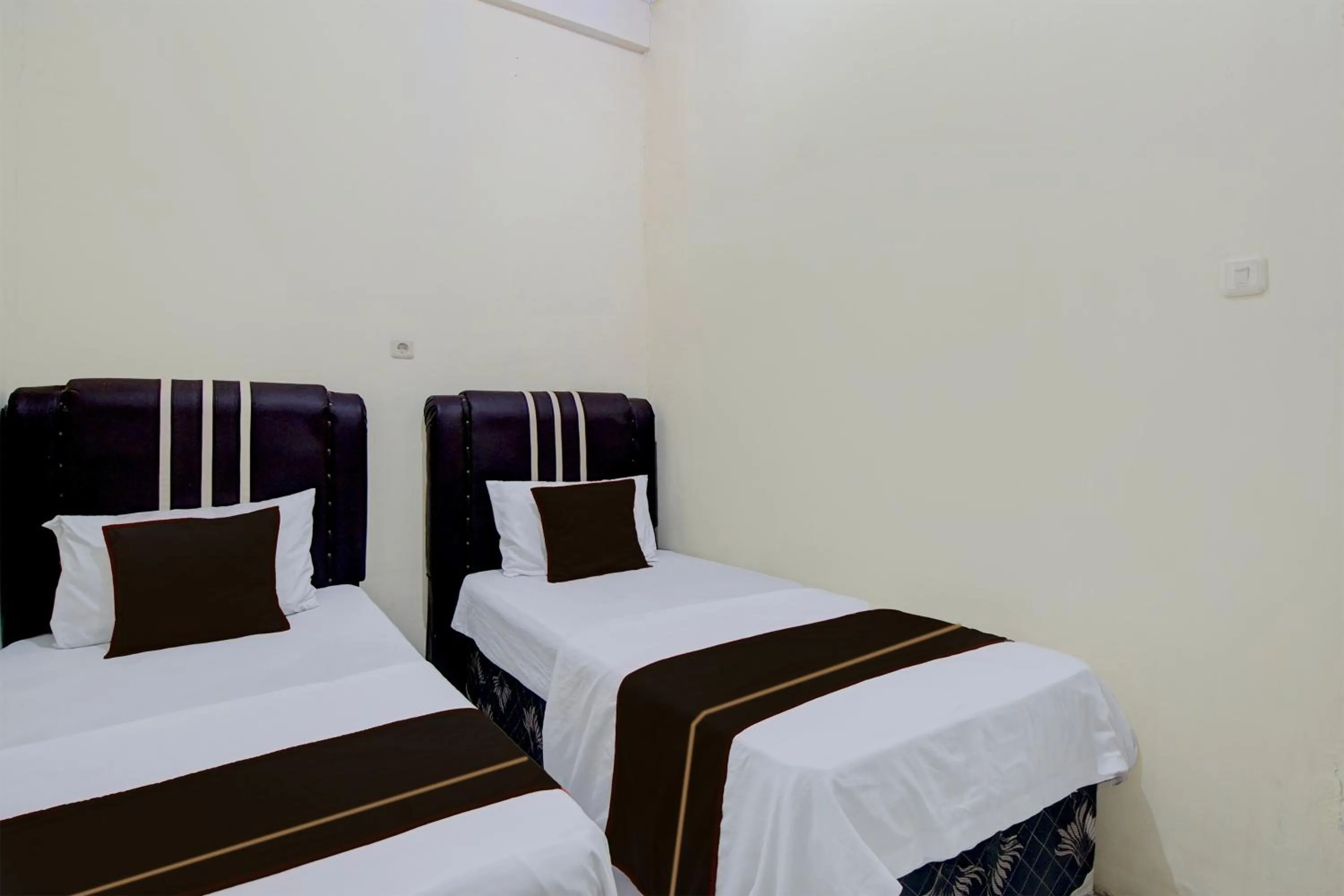 Bedroom, Bed in Hotel O Pekanbaru near Mall Ciputra Seraya formerly Lotus Inn