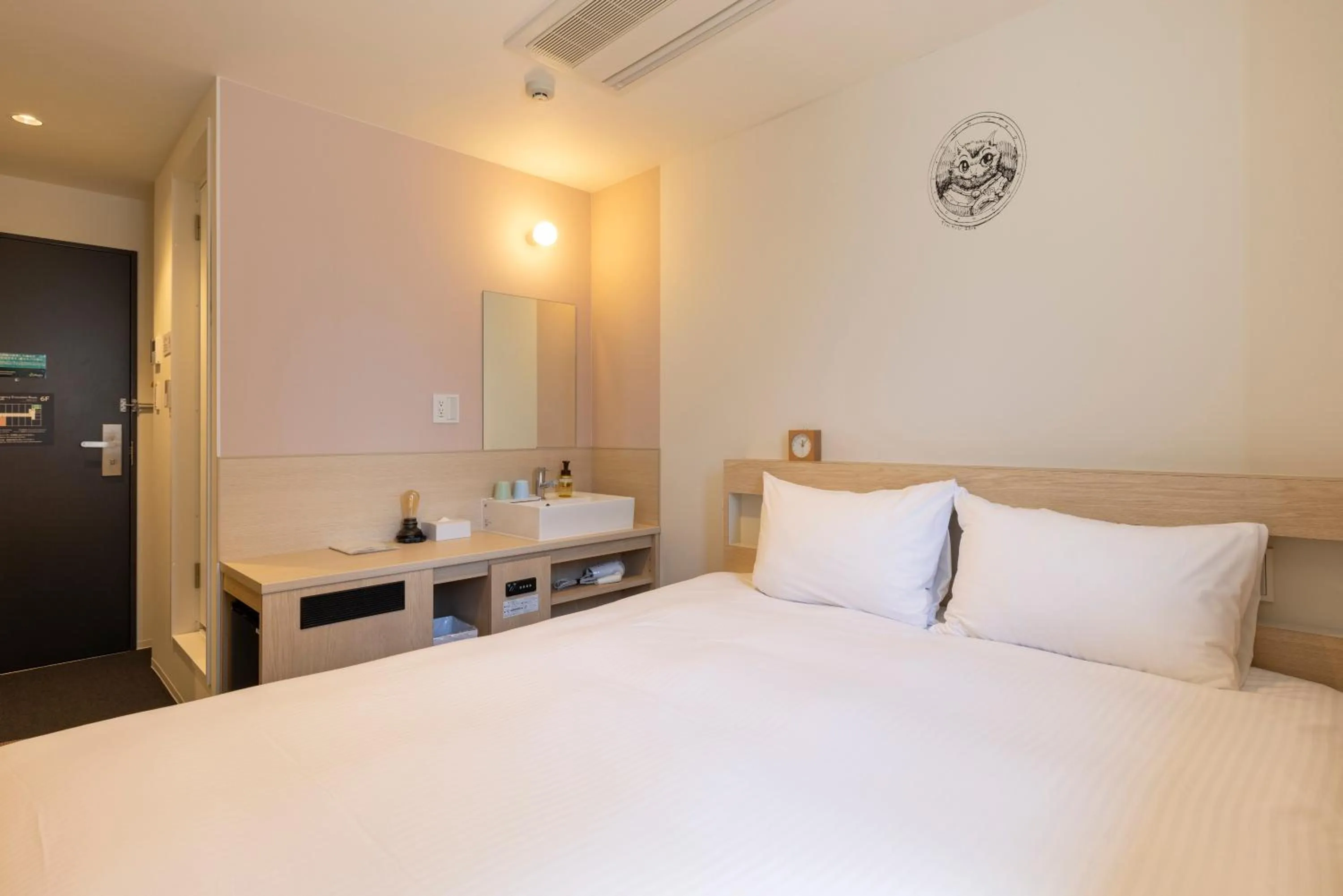 Photo of the whole room, Bed in WeBase Hiroshima