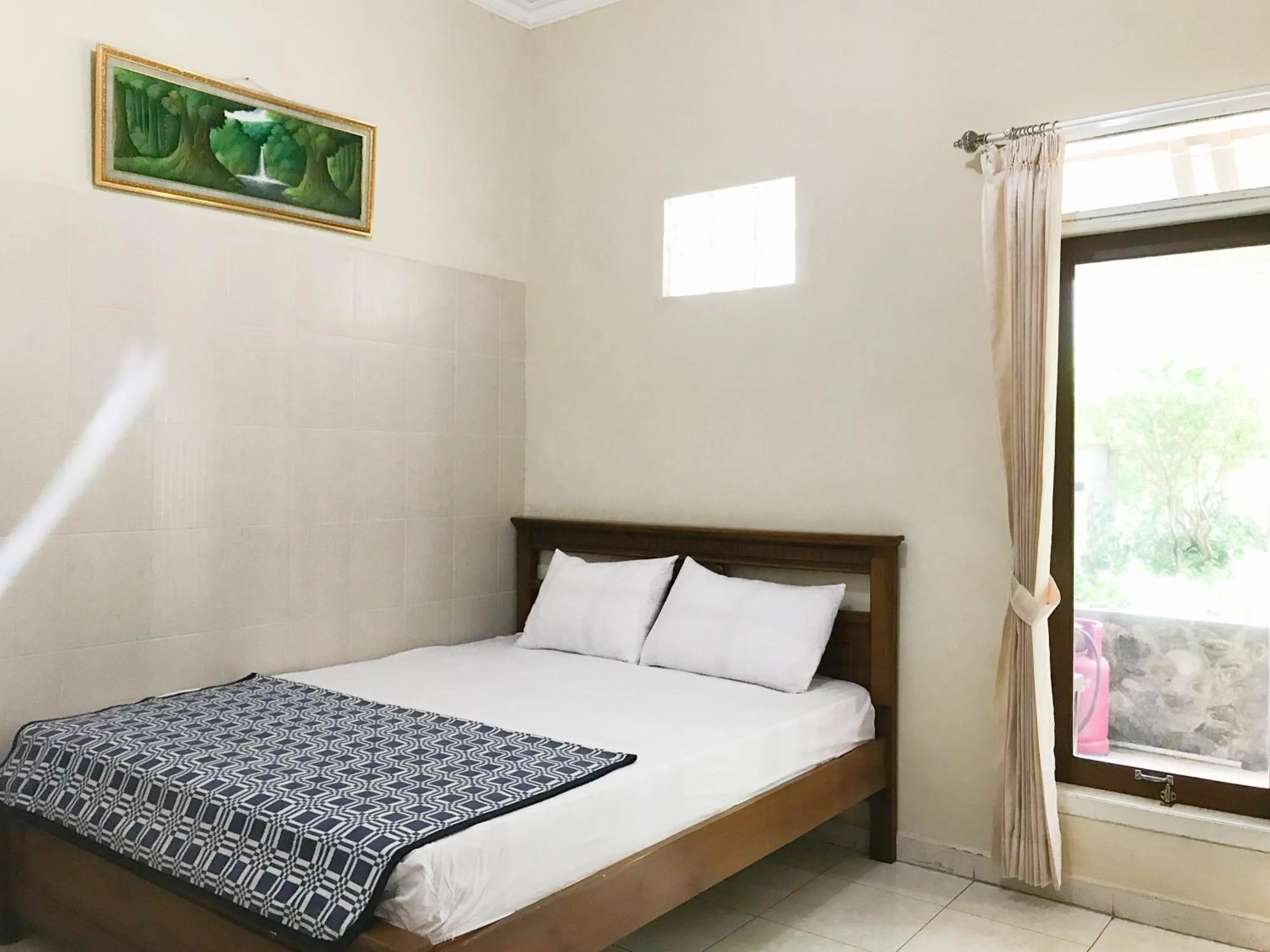 Bedroom, Bed in Villa Bunga Guest House RedPartner
