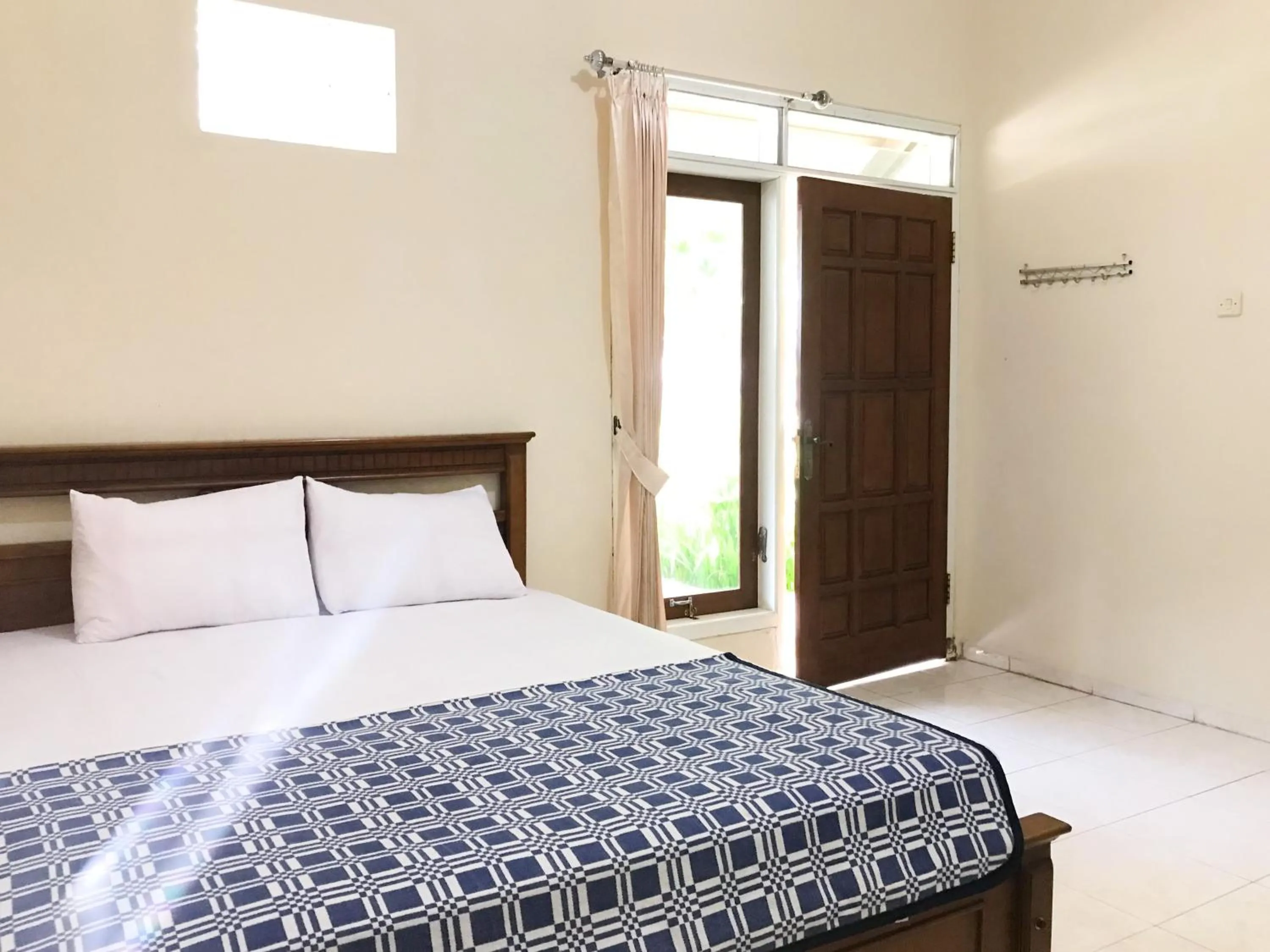 Bedroom, Bed in Villa Bunga Guest House RedPartner
