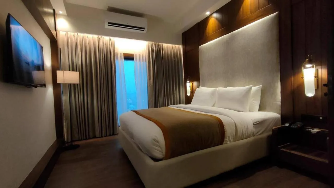 Bed in Hotel Poonja International