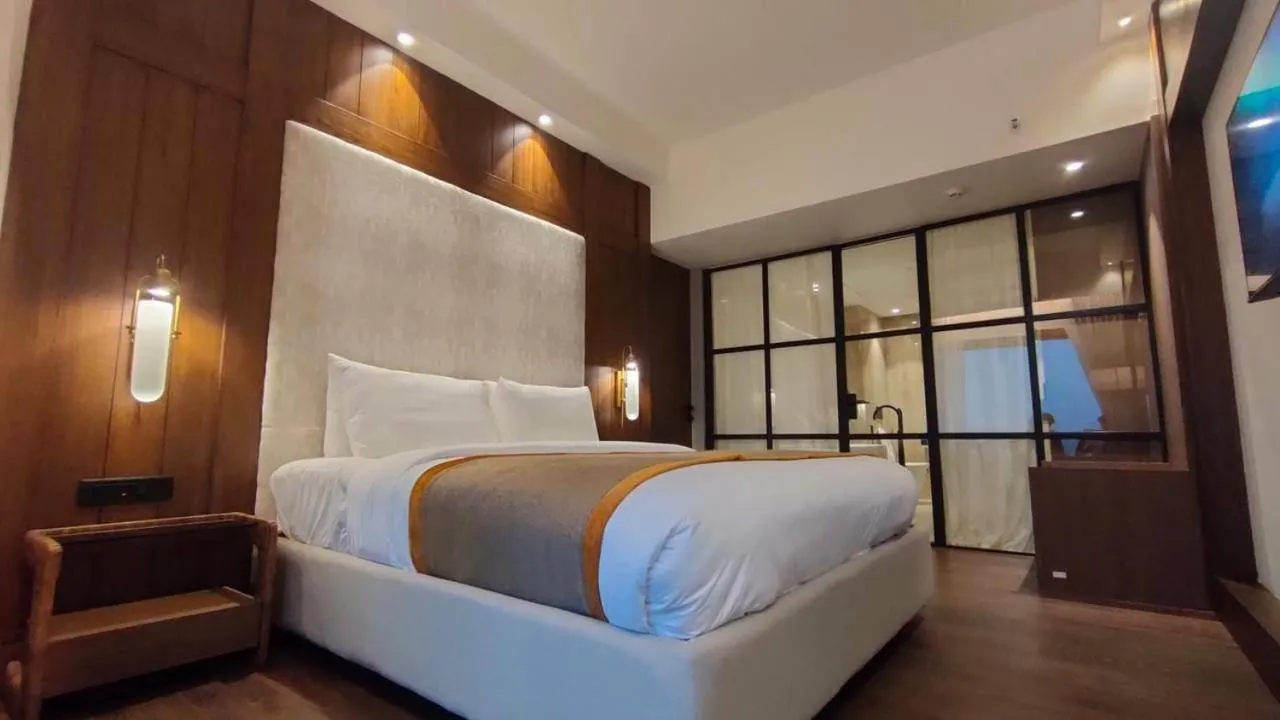 Bed in Hotel Poonja International