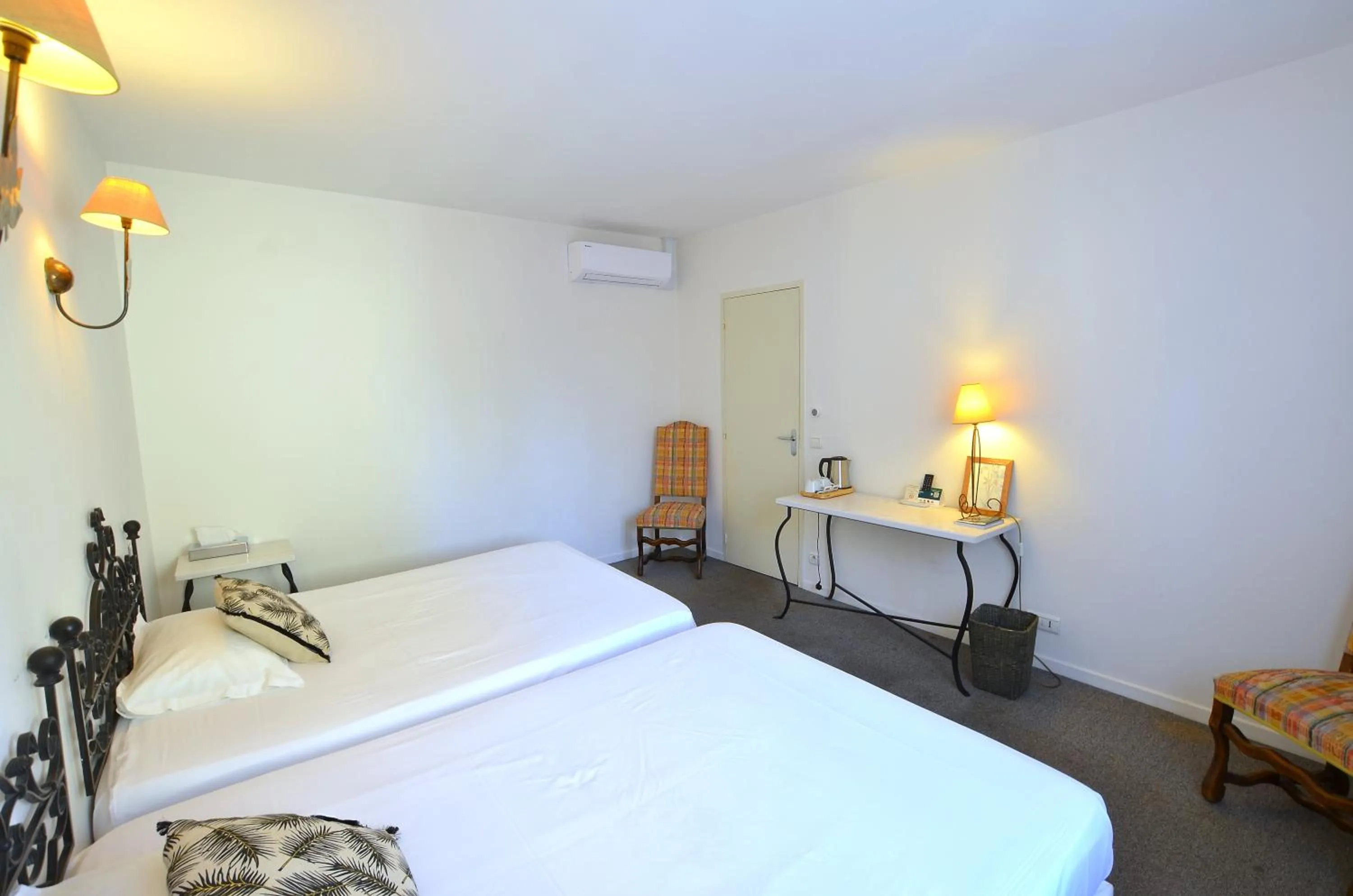 Bedroom, Bed in Logis Hôtels - Hôtel Restaurant du Midi