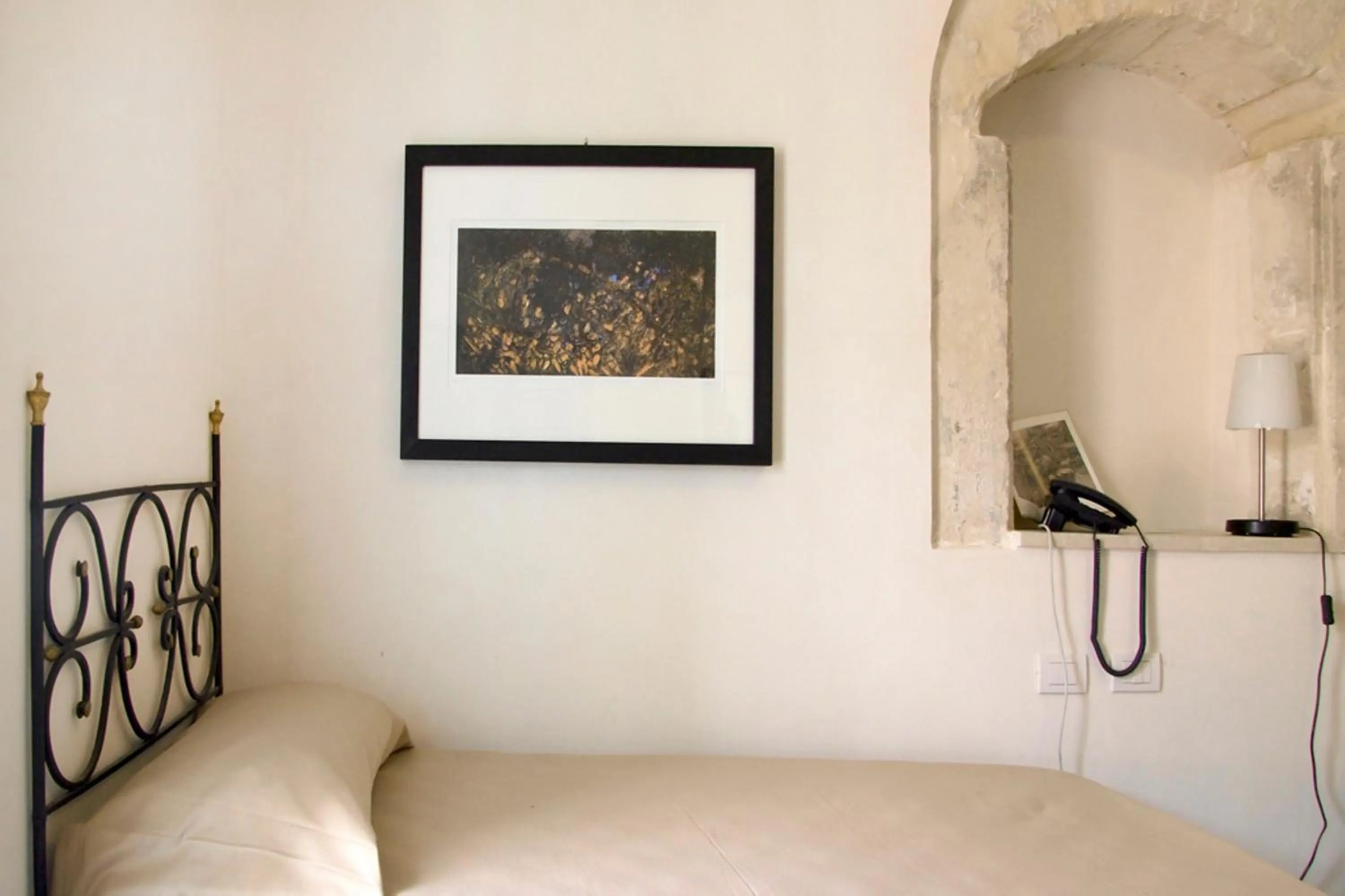 Decorative detail, Bed in Hotel Dell'Orologio