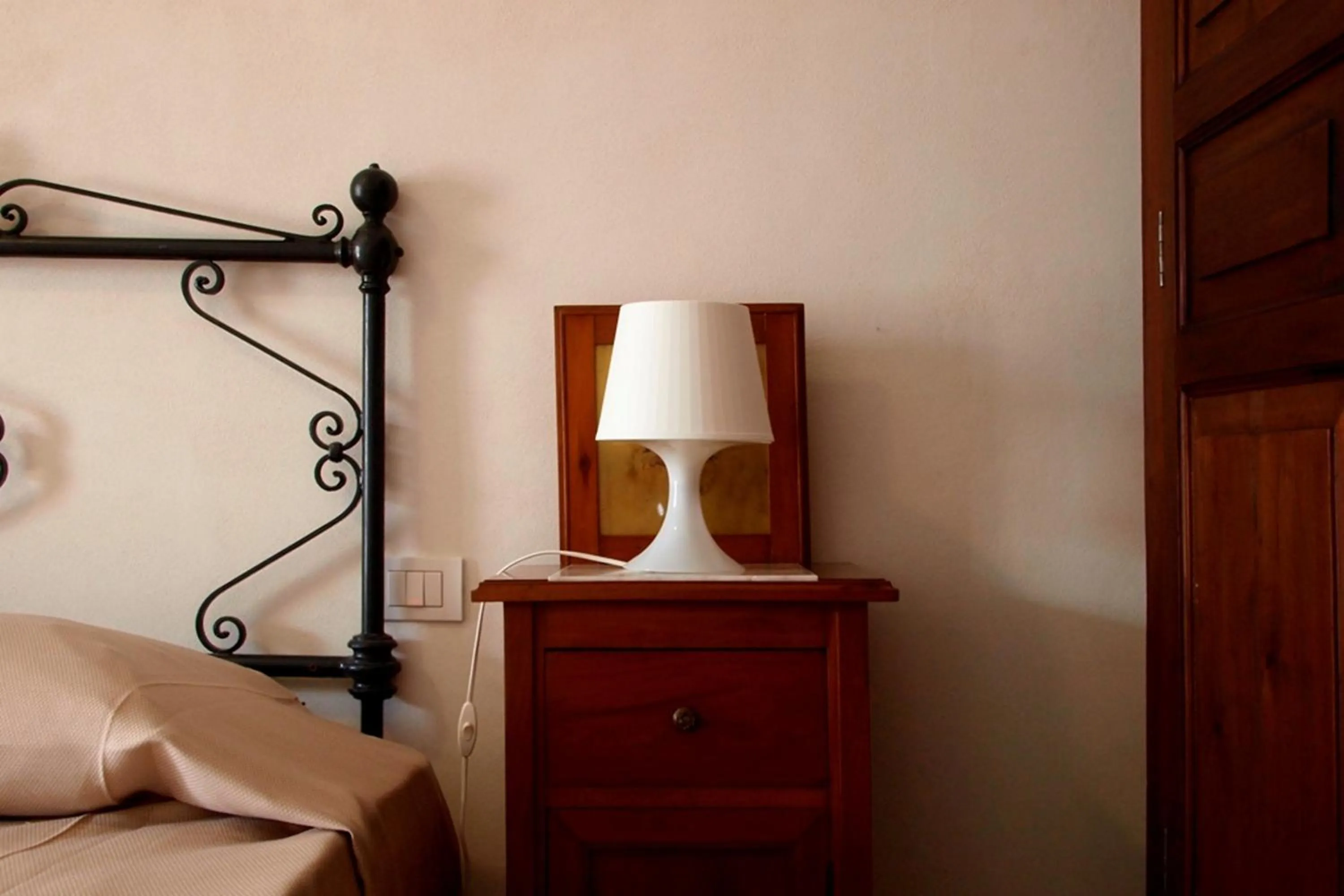 Decorative detail, Bed in Hotel Dell'Orologio