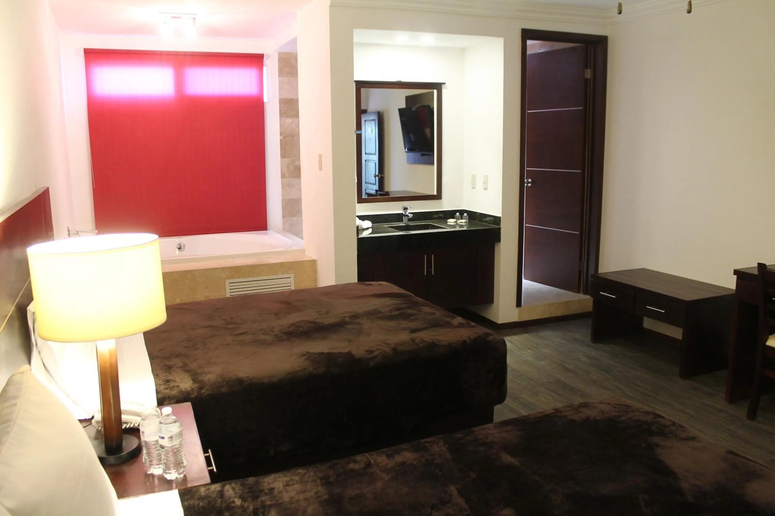 Bed in Hotel Rincon Real Suites