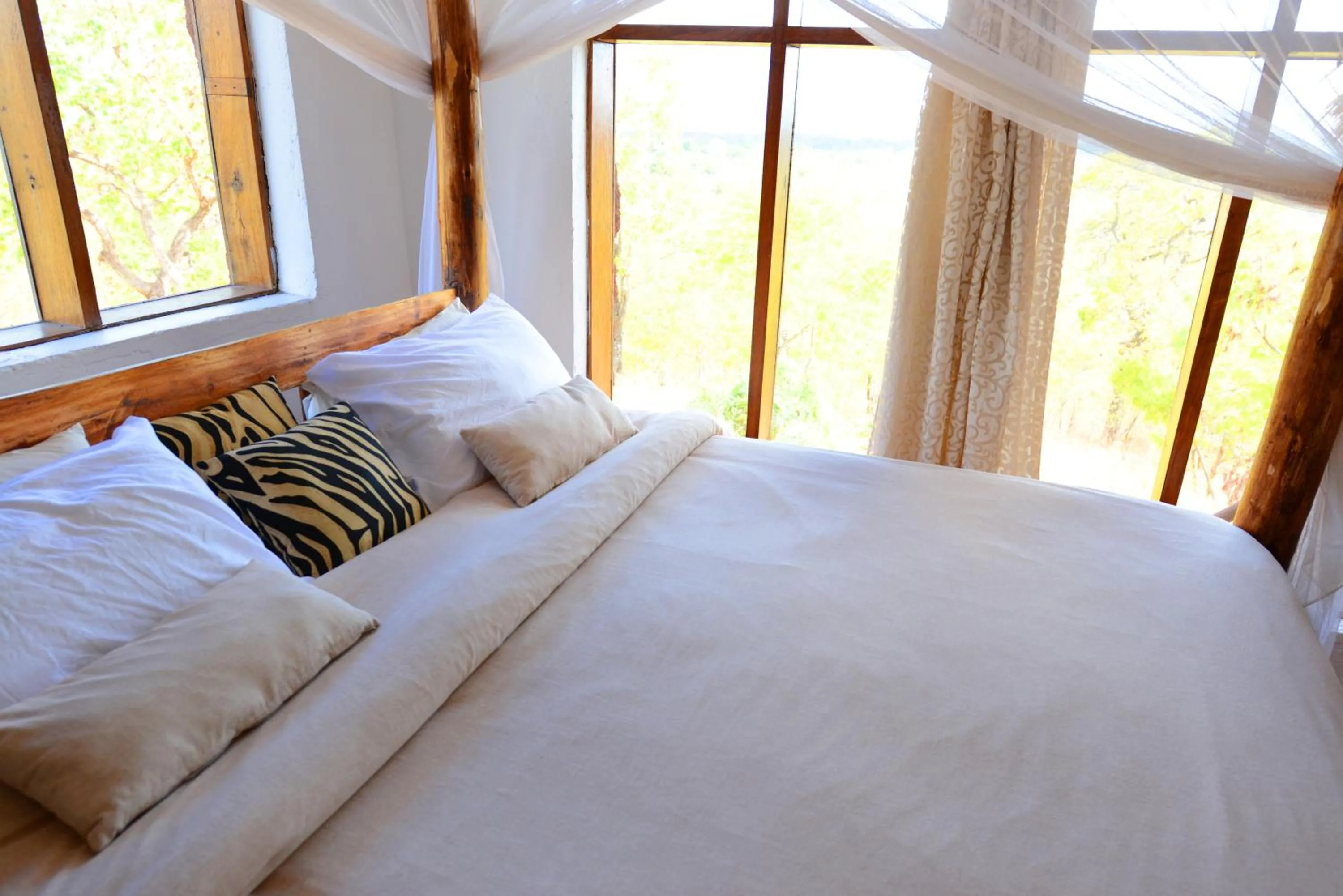Bed in Sable Mountain Lodge, A Tent with a View Safaris