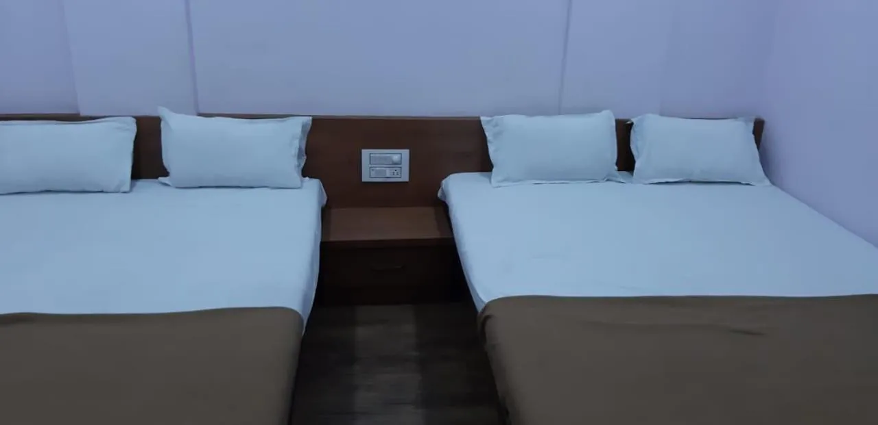 Bed in Rajhuns Deluxe Lodging