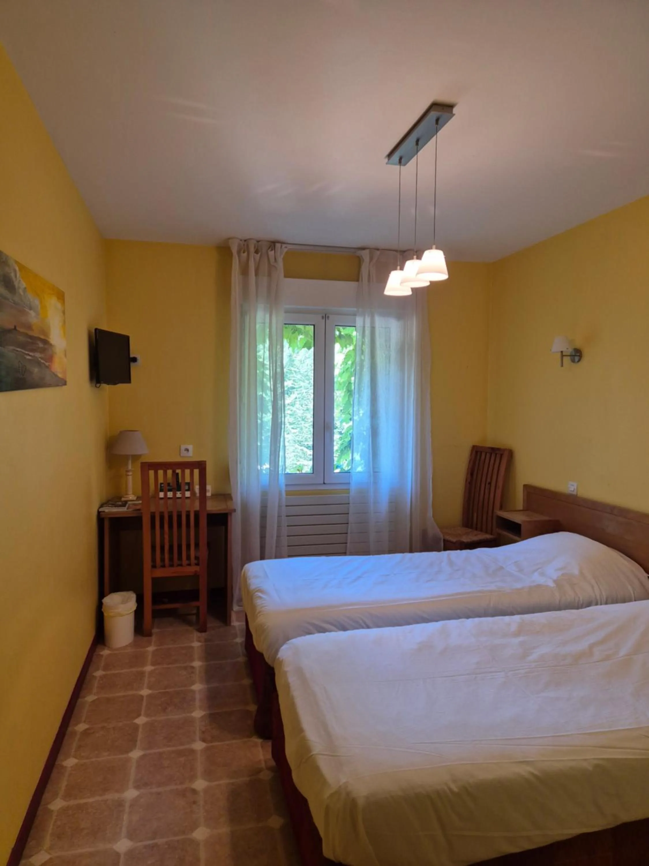 Photo of the whole room, Bed in Logis Hôtel Restaurant Les Norias