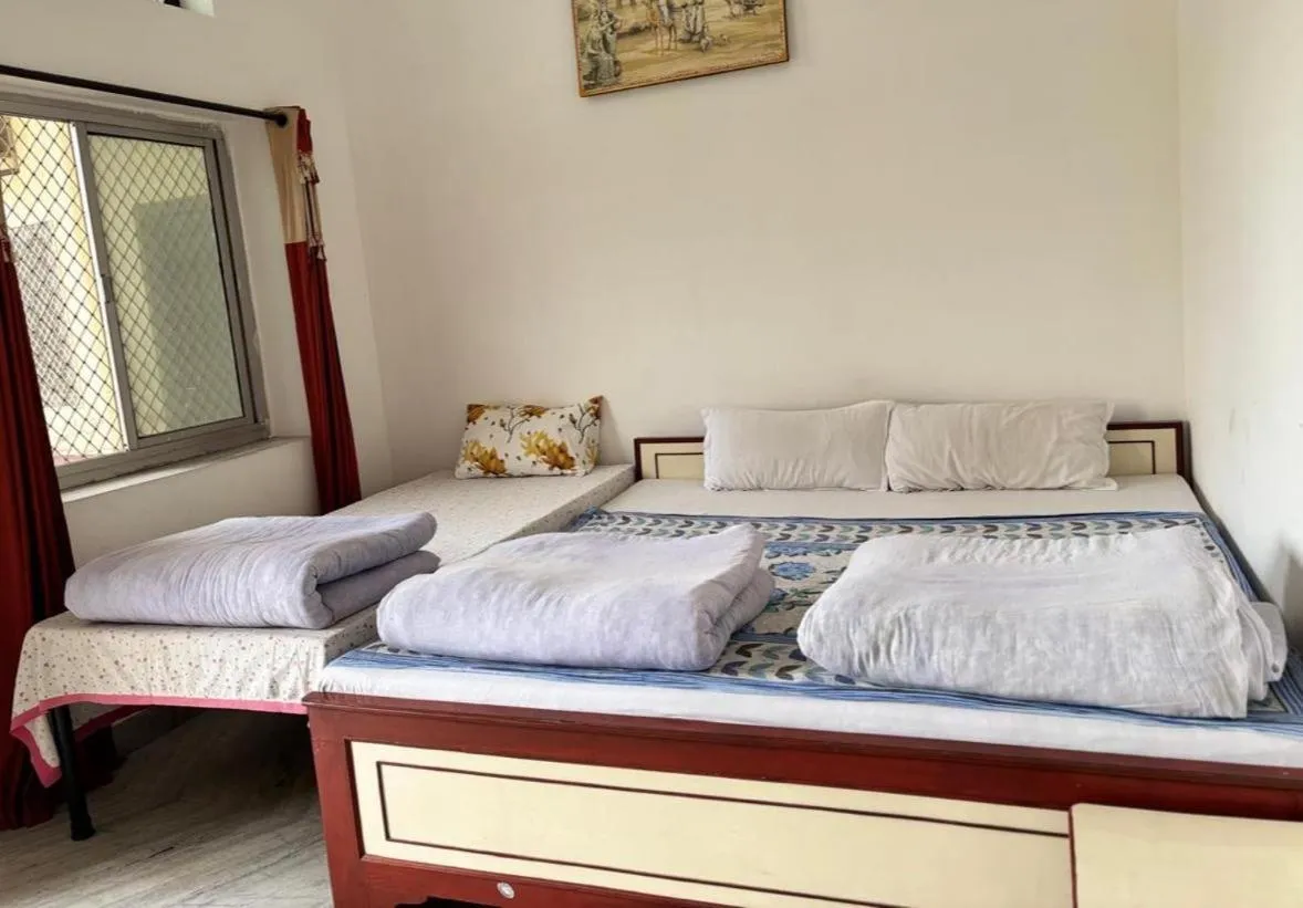 Bed in Keshav Palace -A Family Homestay